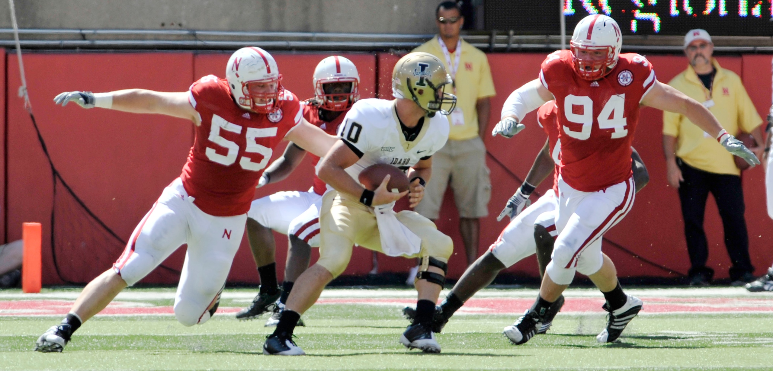 LINCOLN, NEBRASKA - SEPTEMBER 11: Idaho Vandals quarterback Nathan Enderle #10 tries to elude Nebraska Cornhuskers defensive tackle Baker Steinkuhler #55 and Nebraska Cornhuskers defensive tackle Jared Crick #94 during first half action of their game at M