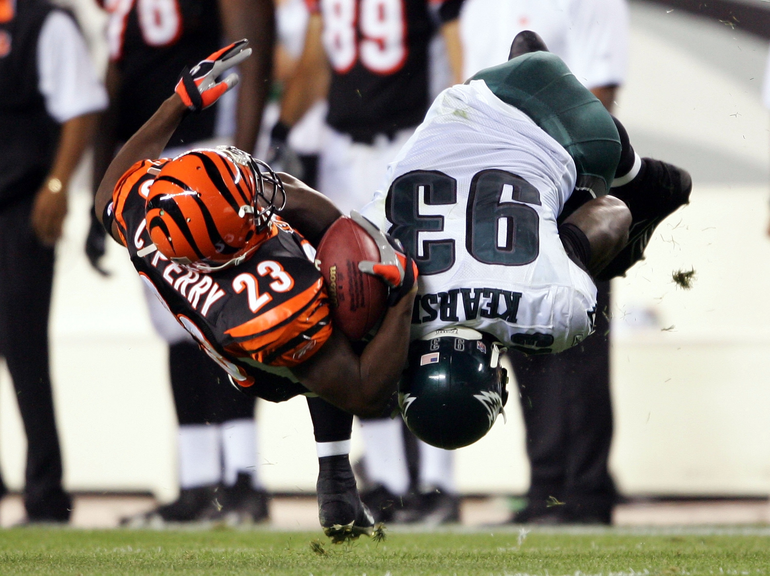 PHILADELPHIA - AUGUST 26: Defensive end Jevon Kearse #93 of the Philadelphia Eagles knocks over running back Chris Perry #23 of the Cincinnati Bengals during the first half of their preseason game on August 26, 2005 at Lincoln Financial Field in Philadel PHILADELPHIA - AUGUST 26: Defensive end Jevon Kearse #93 of the Philadelphia Eagles knocks over running back Chris Perry #23 of the Cincinnati Bengals during the first half of their preseason game on August 26, 2005 at Lincoln Financial Field in Philadel
