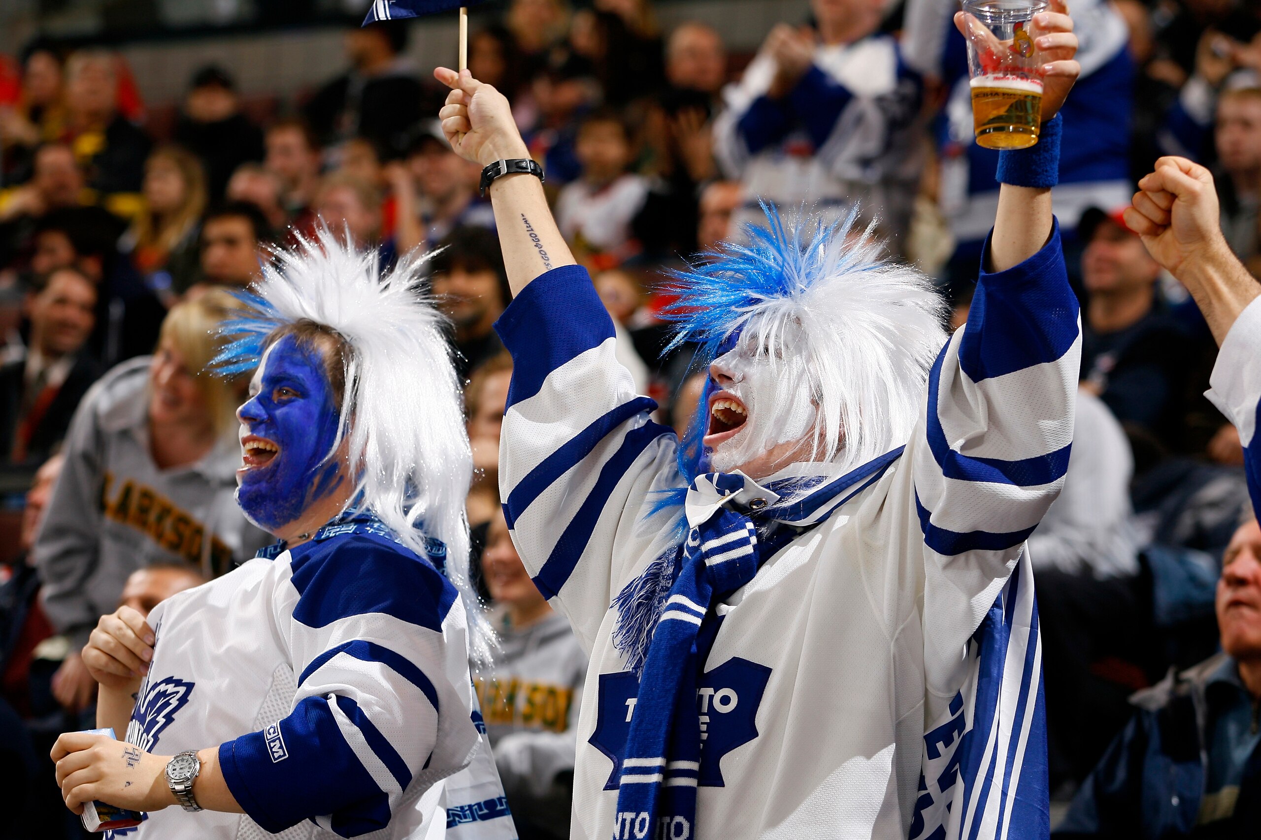 OTTAWA, ON - NOVEMBER 17:  Two lively fans of the Toronto Maple Leafs celebrate a goal against the Ottawa Senators in a game at Scotiabank Place on November 17, 2009 in Ottawa, Canada. (Photo by Phillip MacCallum/Getty Images)