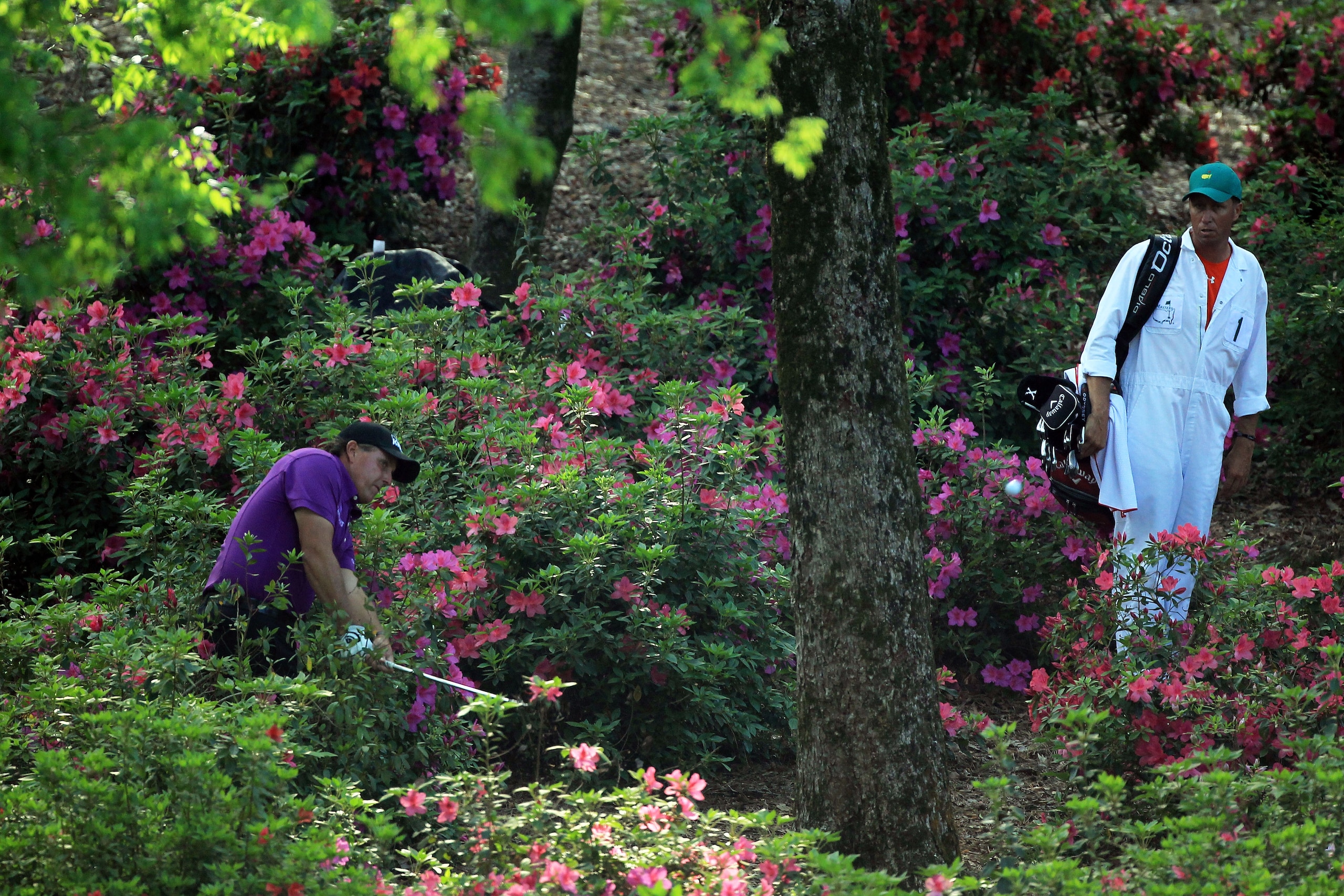 AUGUSTA, GA - APRIL 07:  Phil Mickelson plays his second shot from the flowers on the 13th hole during the first round of the 2011 Masters Tournament at Augusta National Golf Club on April 7, 2011 in Augusta, Georgia.  (Photo by David Cannon/Getty Images)