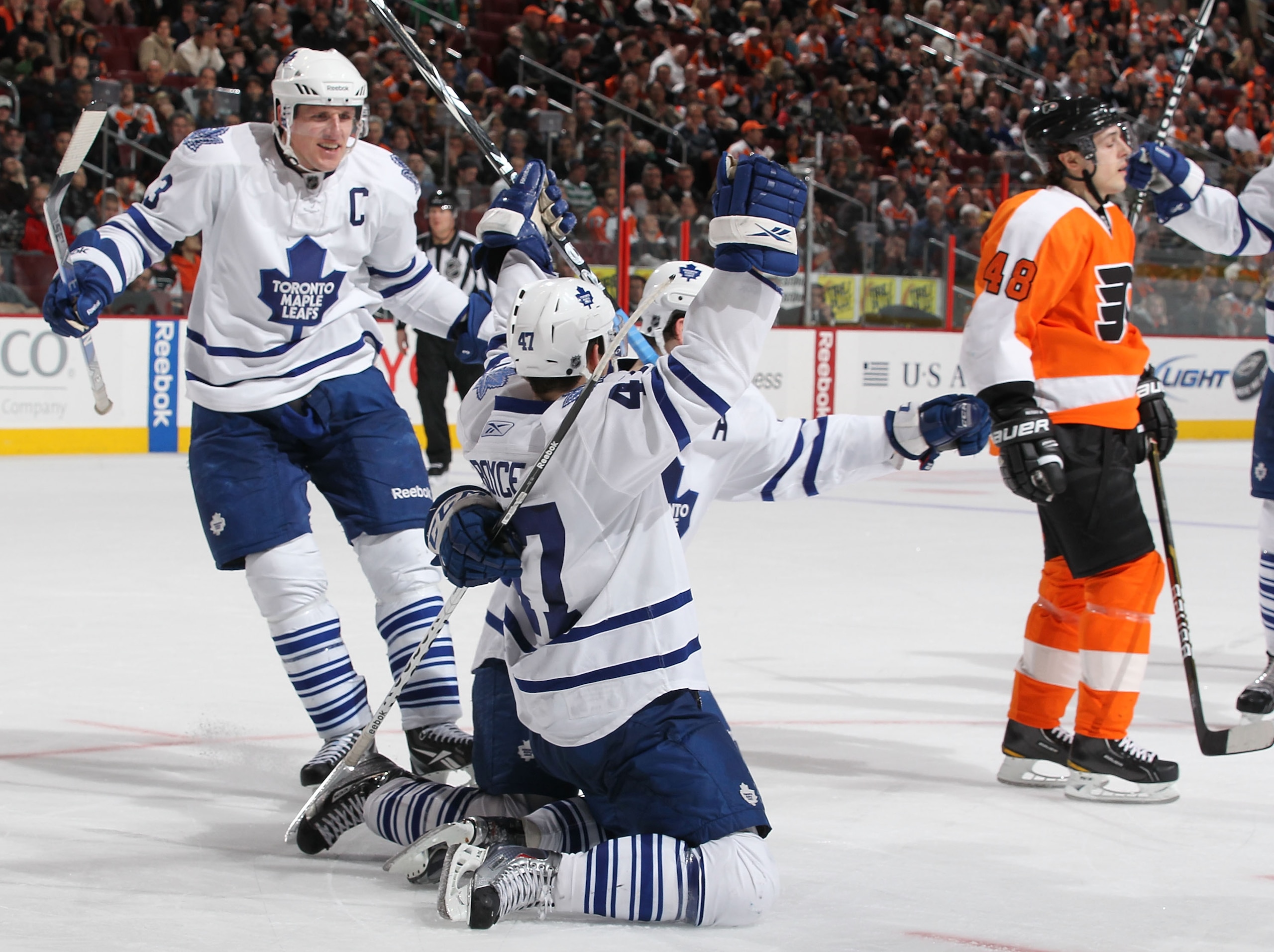 PHILADELPHIA - MARCH 03:  Darryl Boyce #47 of the Toronto Maple Leafs celebrates the winning goal with Dion Phaneuf #3 against  the Philadelphia Flyers during their game on March 3, 2011 at The Wells Fargo Center in Philadelphia, Pennsylvania.  (Photo by