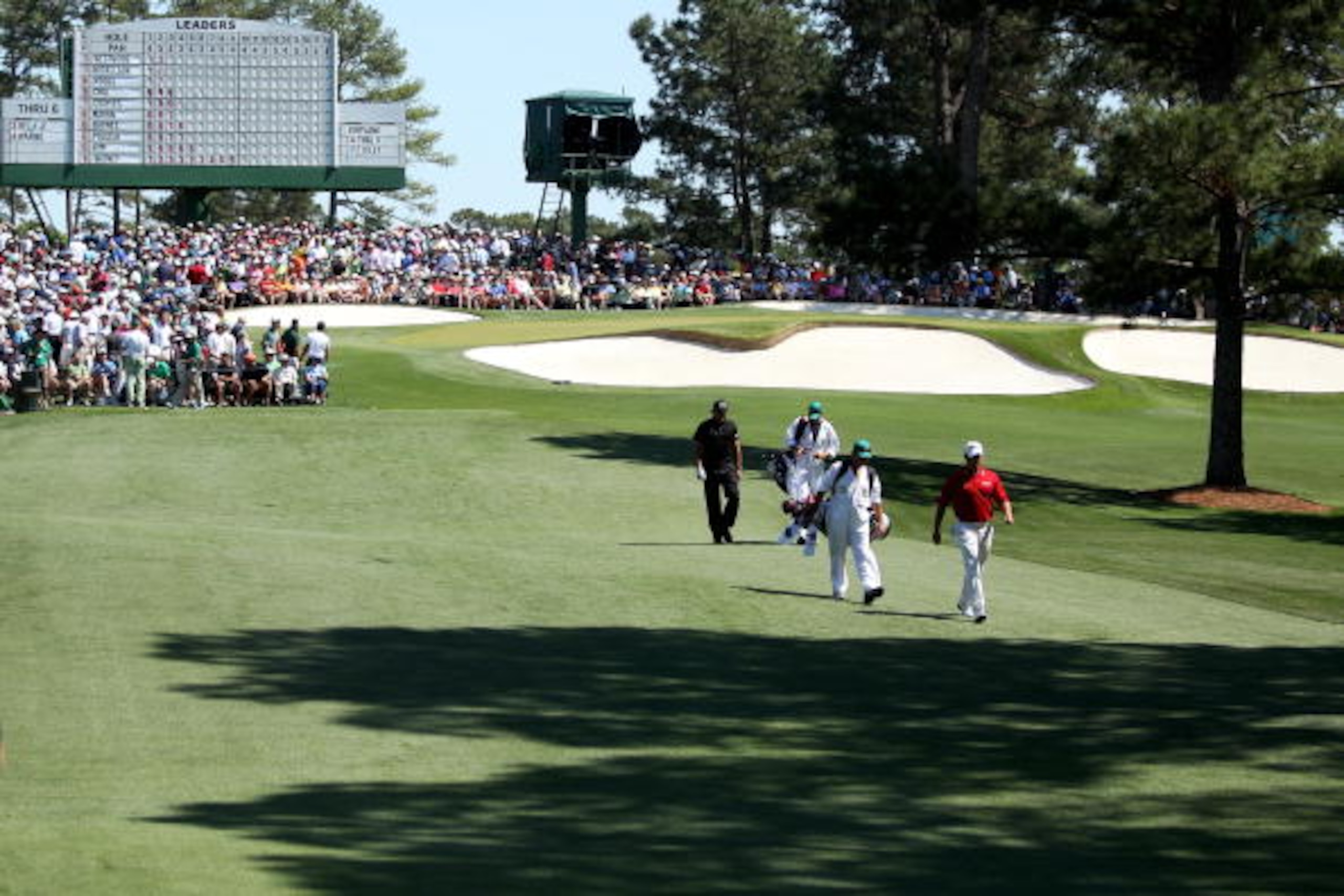 AUGUSTA, GA - APRIL 11:  Phil Mickelson  (L) and Lee Westwood of England walk with their caddies on the third hole during the final round of the 2010 Masters Tournament at Augusta National Golf Club on April 11, 2010 in Augusta, Georgia.  (Photo by Andrew