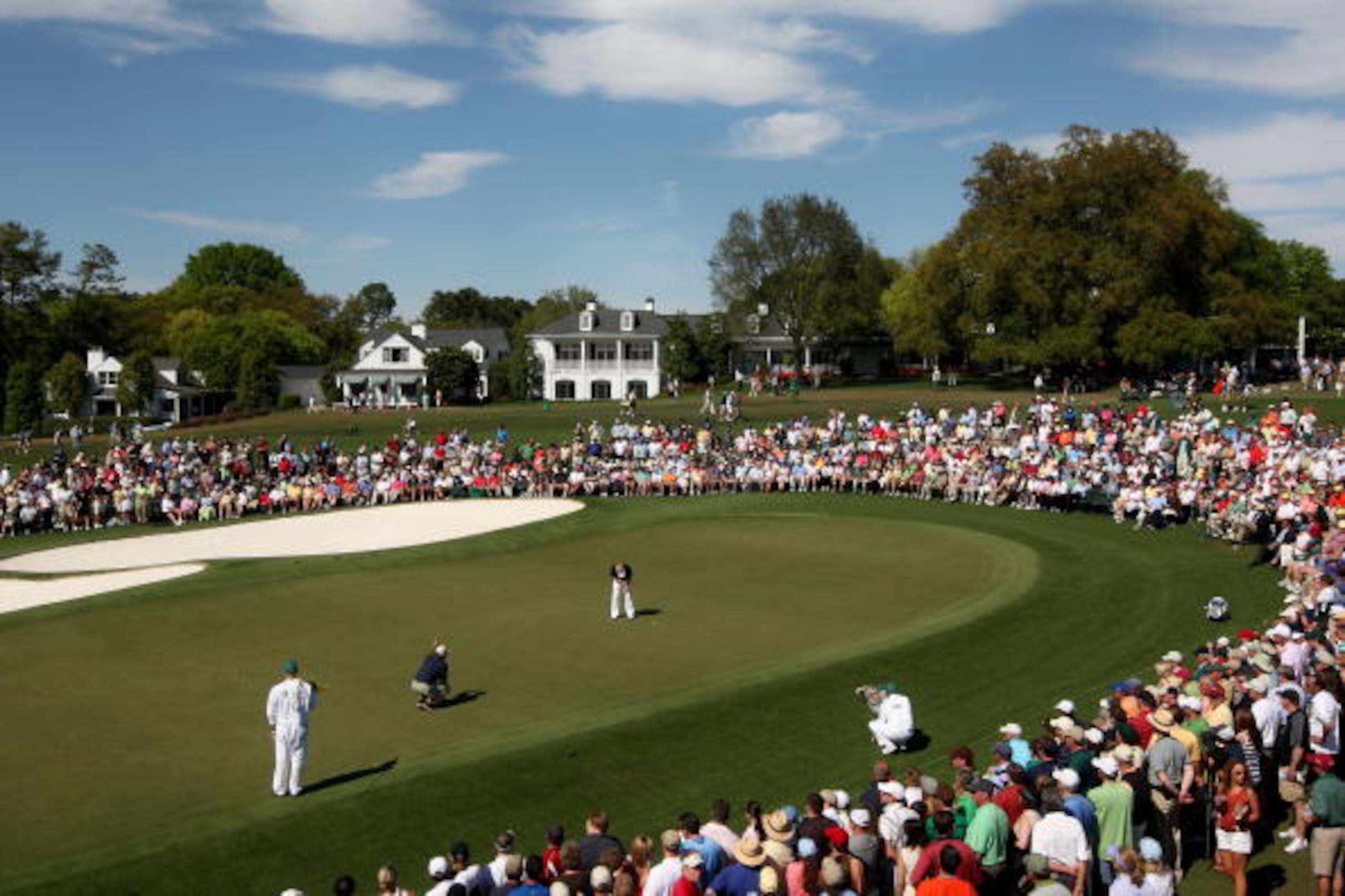 AUGUSTA, GA - APRIL 10:  Soren Kjeldsen of Denmark hits a putt on the ninth green as Fred Couples looks on during the third round of the 2010 Masters Tournament at Augusta National Golf Club on April 10, 2010 in Augusta, Georgia.  (Photo by Jamie Squire/G