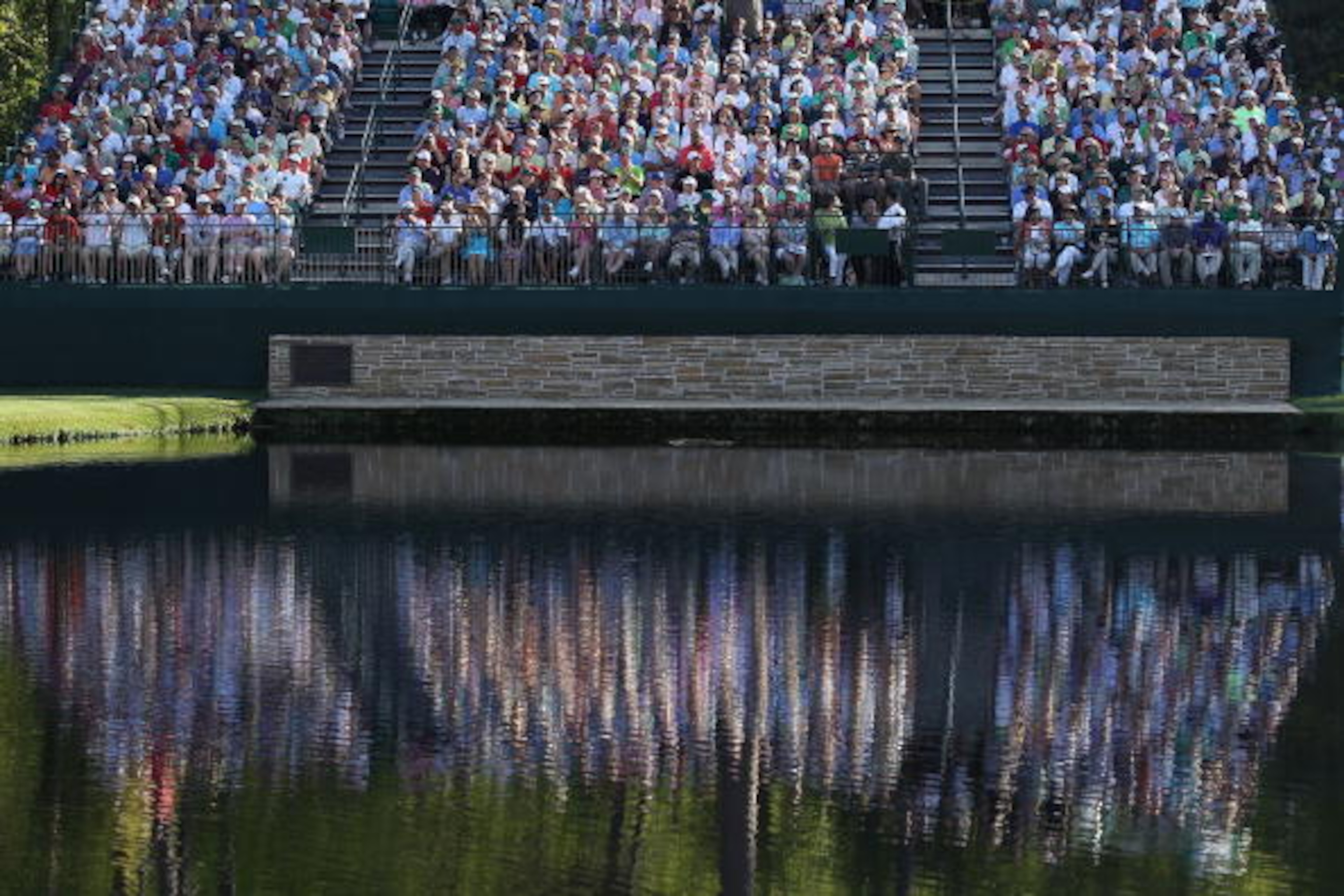 AUGUSTA, GA - APRIL 11: A general view of the crowd on the 15th hole during the final round of the 2010 Masters Tournament at Augusta National Golf Club on April 11, 2010 in Augusta, Georgia. (Photo by Streeter Lecka/Getty Images for Golf Week) AUGUSTA, GA - APRIL 11: A general view of the crowd on the 15th hole during the final round of the 2010 Masters Tournament at Augusta National Golf Club on April 11, 2010 in Augusta, Georgia. (Photo by Streeter Lecka/Getty Images for Golf Week)