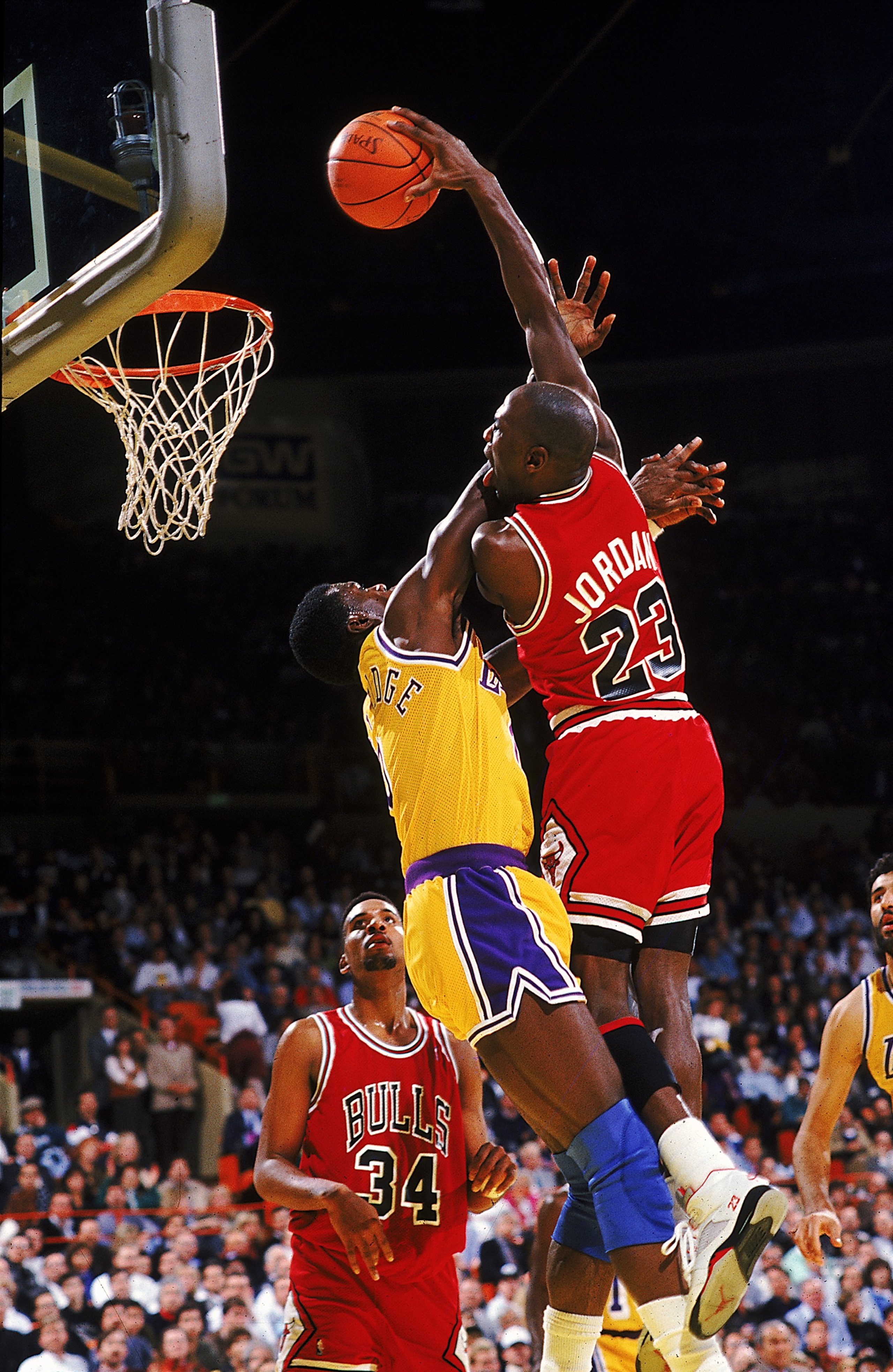 Michael Jordan #23 of the Chicago Bulls dunks the ball during a game against the Los Angeles Lakers.