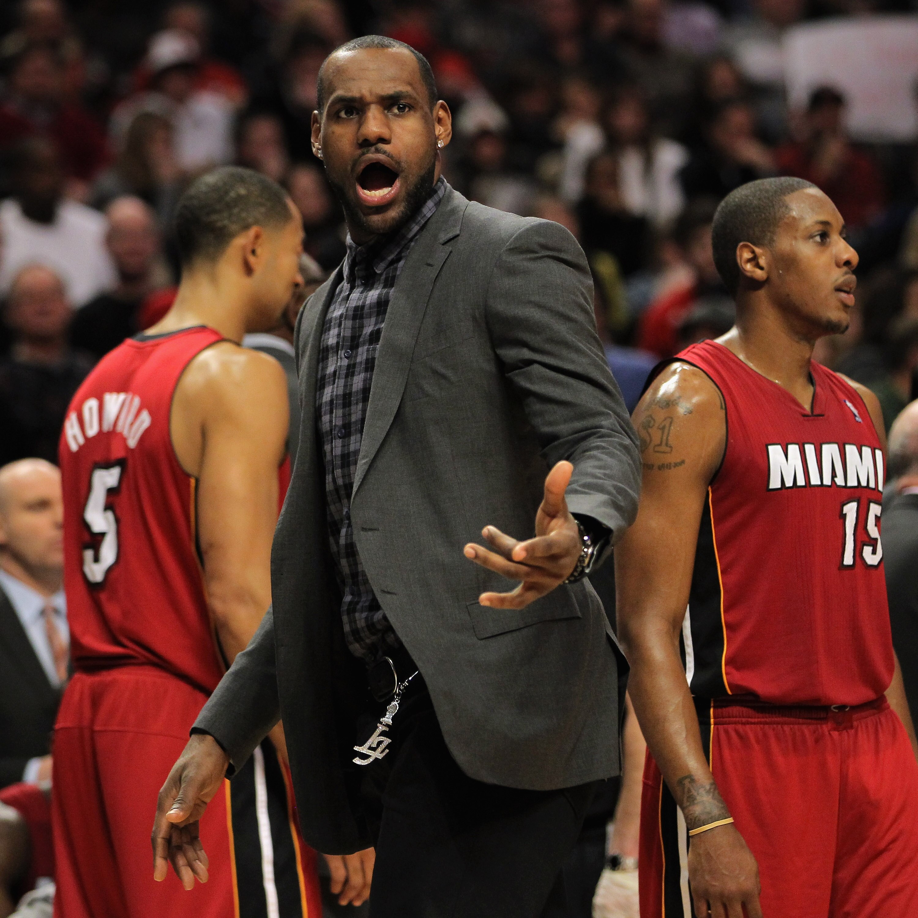 CHICAGO, IL - JANUARY 15:  LeBron James #6 of the Miami Heat protests a call with the referees as he sits out the game against the Chicago Bulls with an injured ankle at the United Center on January 15, 2011 in Chicago, Illinois. The Bulls defeated the He