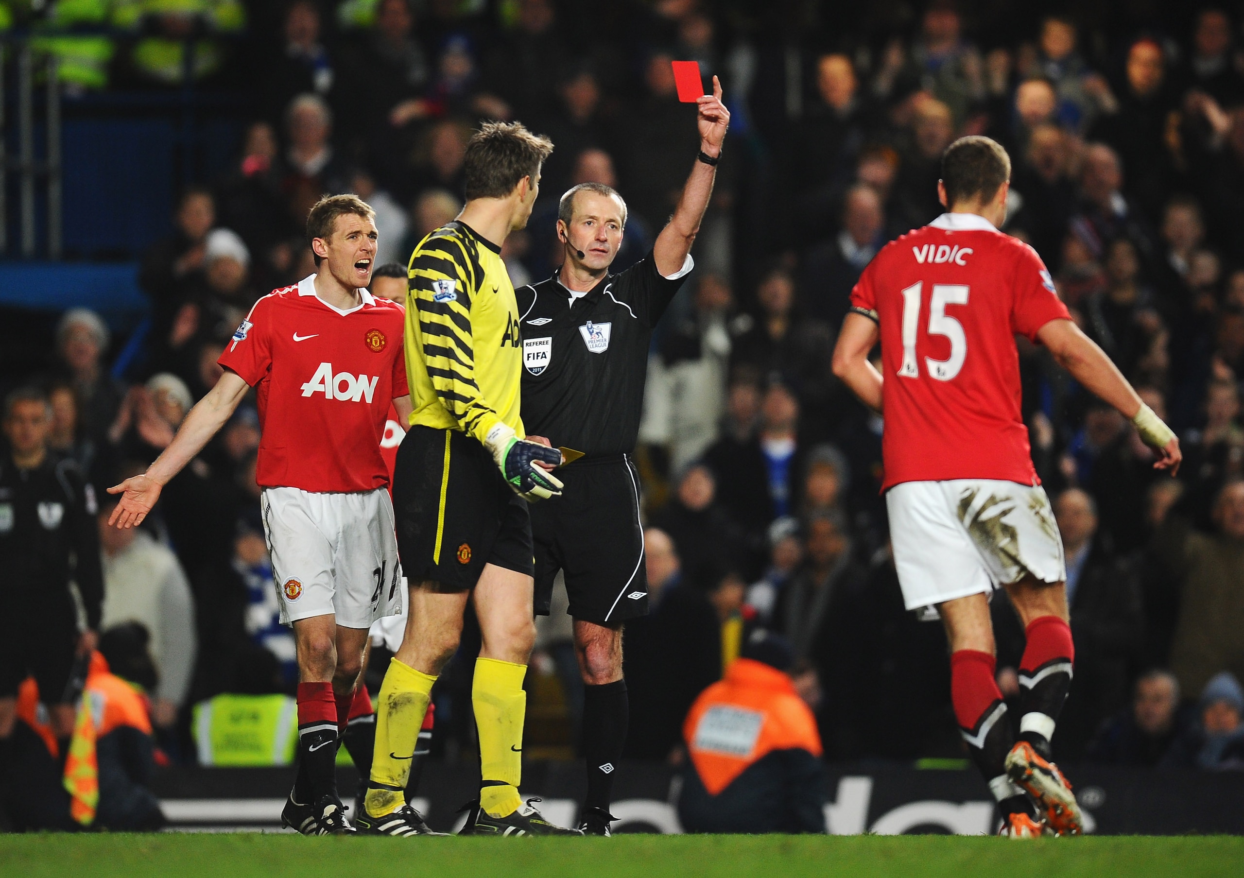 LONDON, ENGLAND - MARCH 01: Nemanja Vidic of Manchester United is shown the red card by referee Martin Atkinson during the Barclays Premier League match between Chelsea and Manchester United at Stamford Bridge on March 1, 2011 in London, England.  (Photo