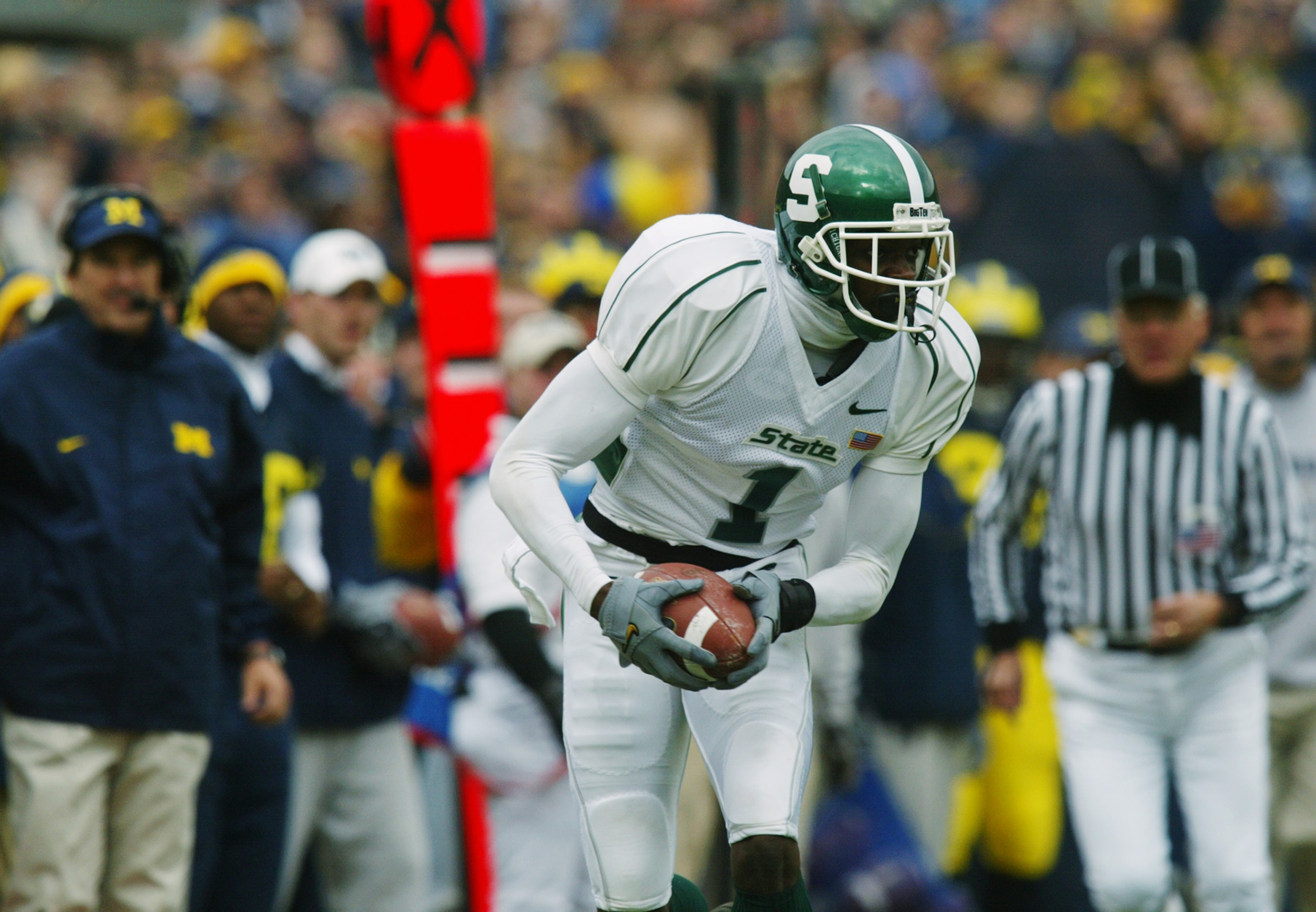 ANN ARBOR, MI - NOVEMBER 2:  Wide Receiver Charles Rogers #1 of the Michigan State Spartans runs the ball against the Michigan Wolverines during the game on November 2, 2002 at Michigan Stadium in Ann Arbor, Michigan. Michigan won 49-3.  (Photo by Danny M