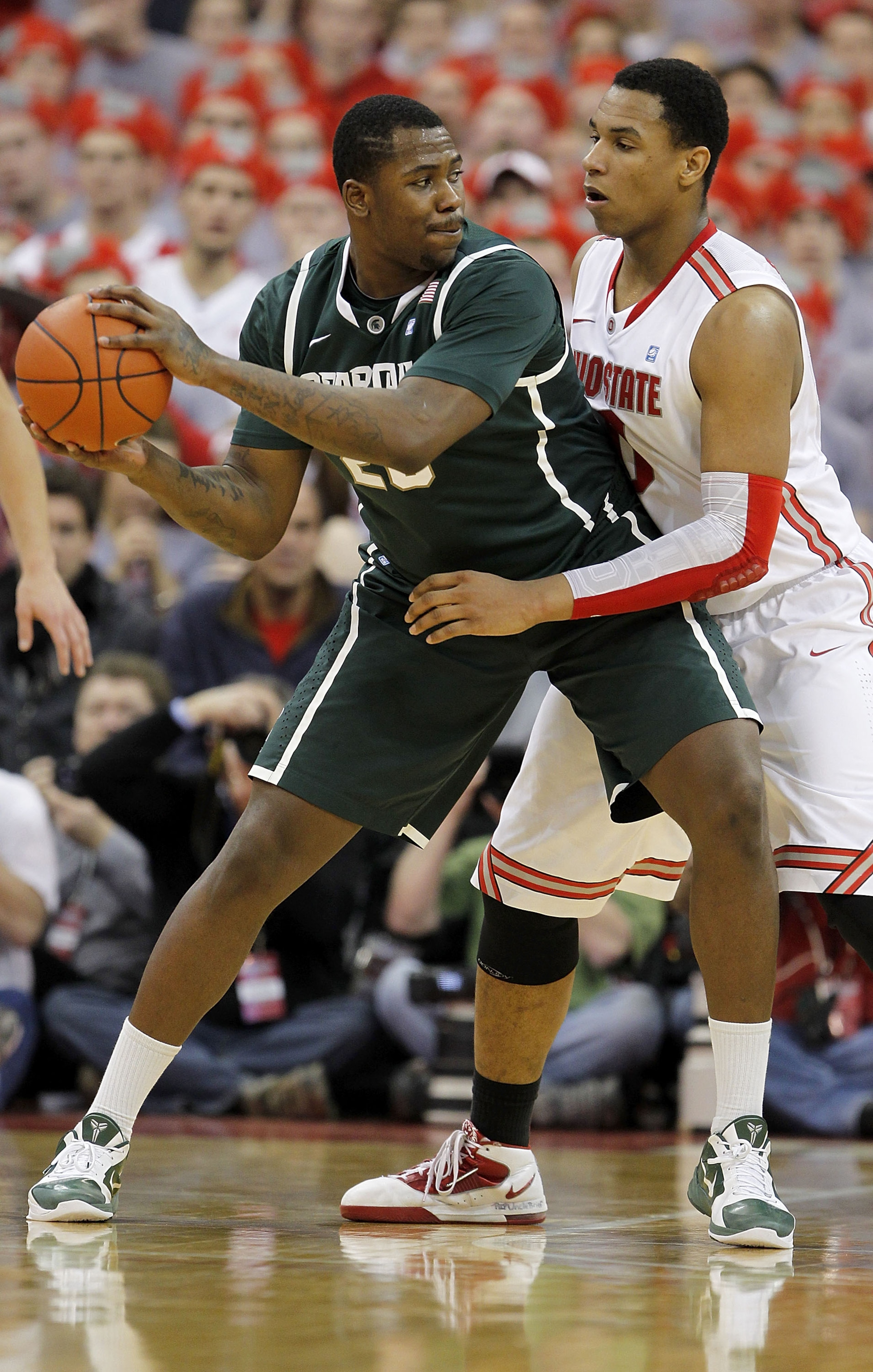 COLUMBUS, OH - FEBRUARY 15:  Jared Sullinger #0 of the Ohio State Buckeyes guards Derrick Nix #25 of the Michigan State Spartans during the second half on February 15, 2011 at Value City Arena in Columbus, Ohio.  (Photo by Gregory Shamus/Getty Images)