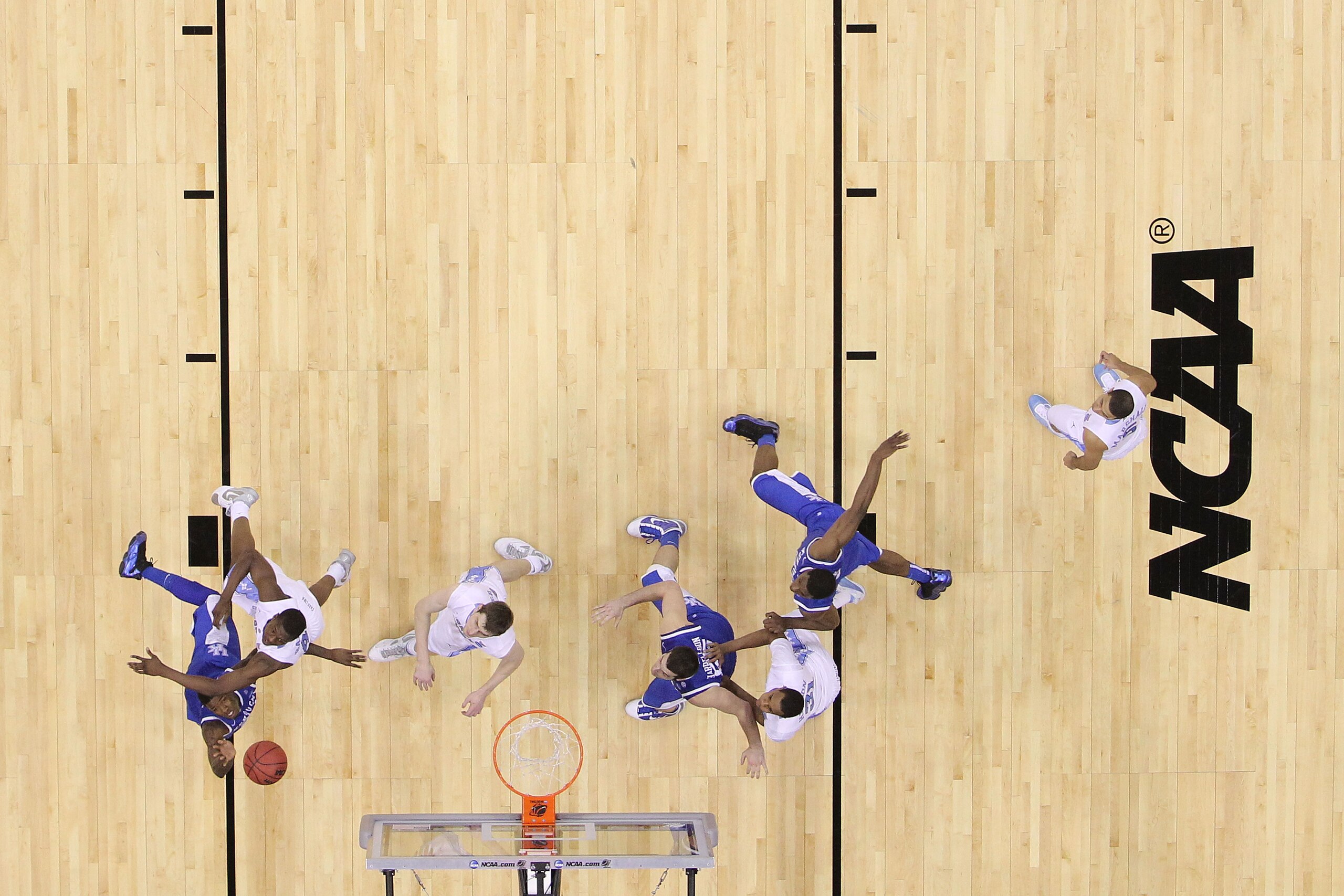 NEWARK, NJ - MARCH 27:  DeAndre Liggins #34 of the Kentucky Wildcats goes to the net against Harrison Barnes #40 of the North Carolina Tar Heels during the east regional final of the 2011 NCAA men's basketball tournament at Prudential Center on March 27,