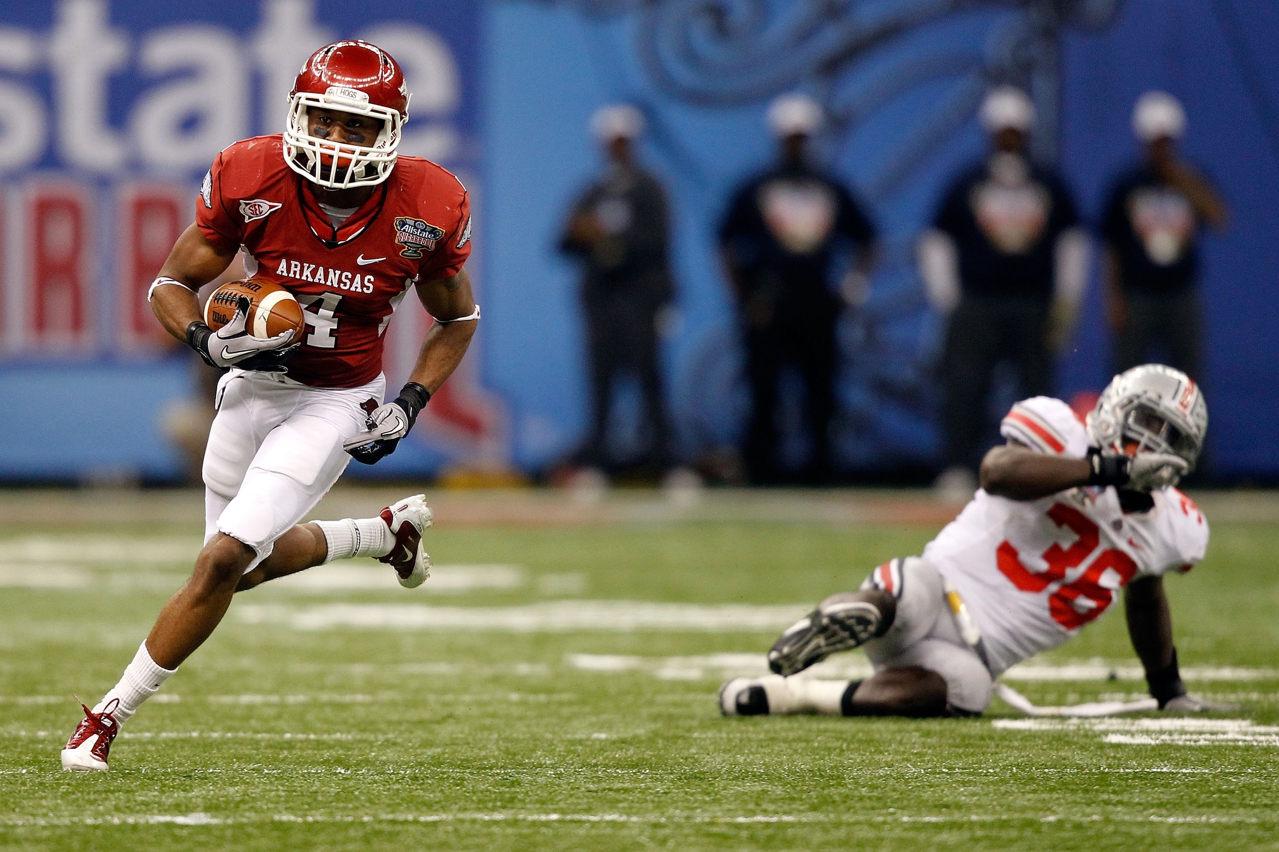NEW ORLEANS, LA - JANUARY 04:  Jarius Wright #4 of the Arkansas Razorbacks runs after a catch against the Ohio State Buckeyes during the Allstate Sugar Bowl at the Louisiana Superdome on January 4, 2011 in New Orleans, Louisiana.  (Photo by Matthew Stockm