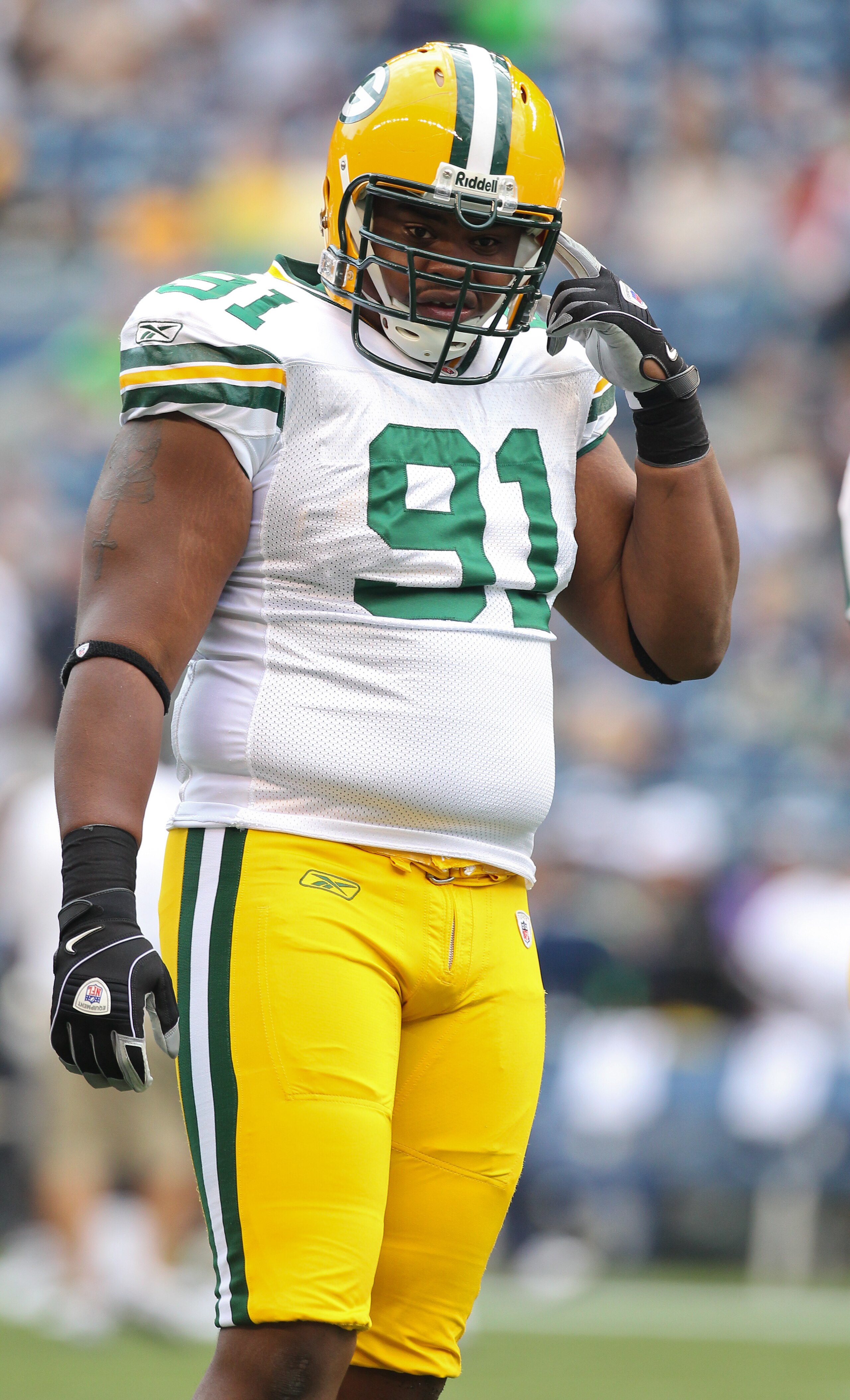 SEATTLE - AUGUST 21:  Defensive end Justin Harrell #91 of the Green Bay Packers looks on during warmups prior to the preseason game against the Seattle Seahawks at Qwest Field on August 21, 2010 in Seattle, Washington. (Photo by Otto Greule Jr/Getty Image