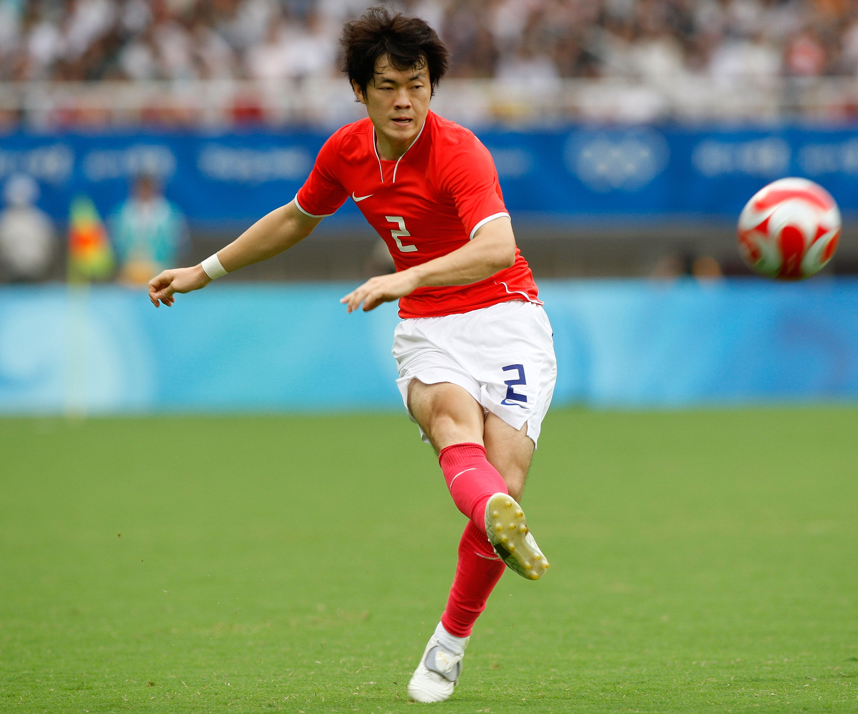 SHANGHAI, CHINA - AUGUST 13:  Shin Kwang Hoon of South Korea passes the ball during the Men's Group D match between South Korea and Honduras at Shanghai Stadium on Day 5 of the Beijing 2008 Olympic Games on August 13, 2008 in Shanghai, China.  (Photo by N