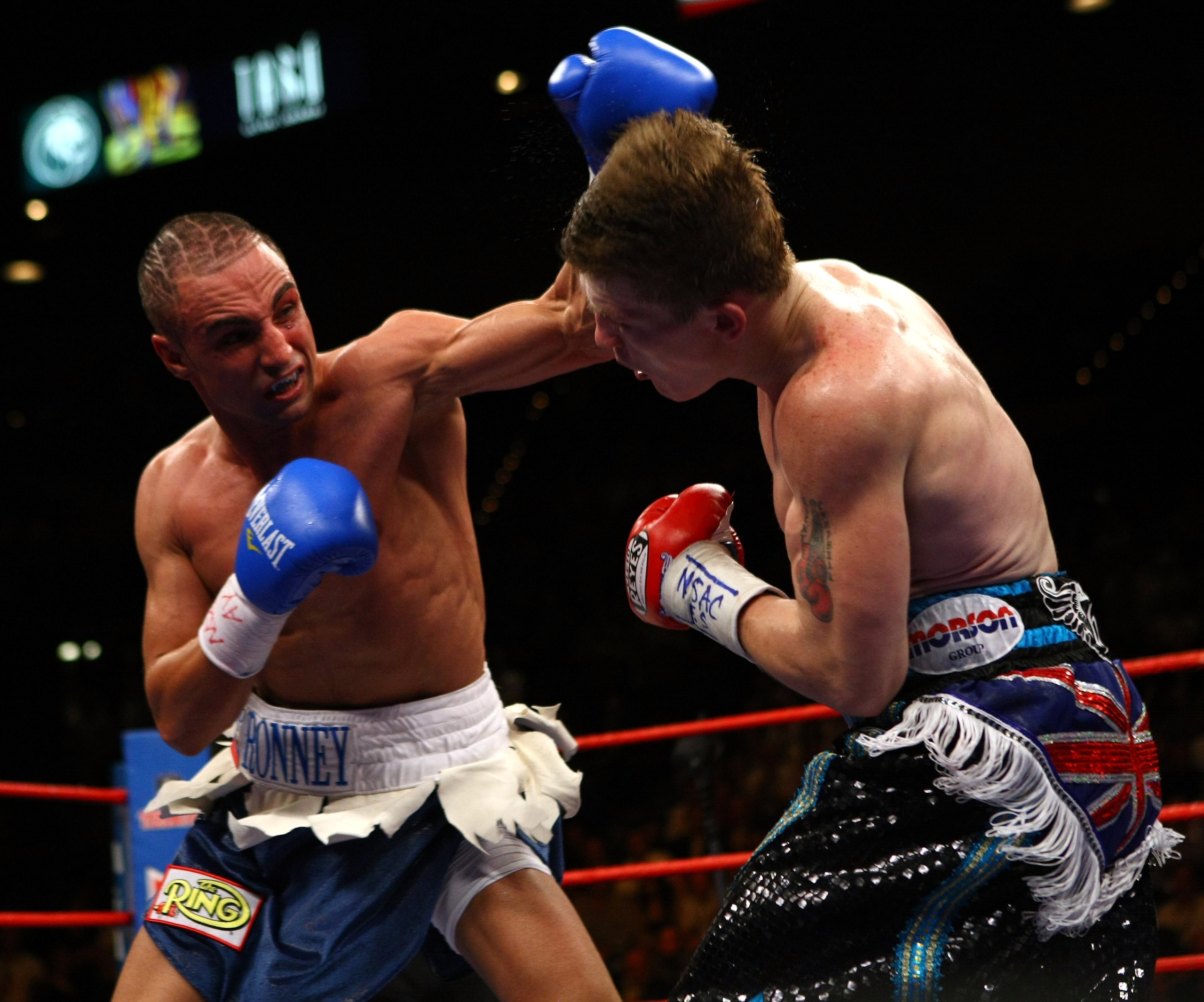 LAS VEGAS - NOVEMBER 22:  Ricky Hatton of England (R) attacks Paulie Malinaggi of USA during their Light-welterweight title fight at the MGM Grand Garden Arena on November 22, 2008 in Las Vegas, Nevada.  (Photo by John Gichigi/Getty Images)