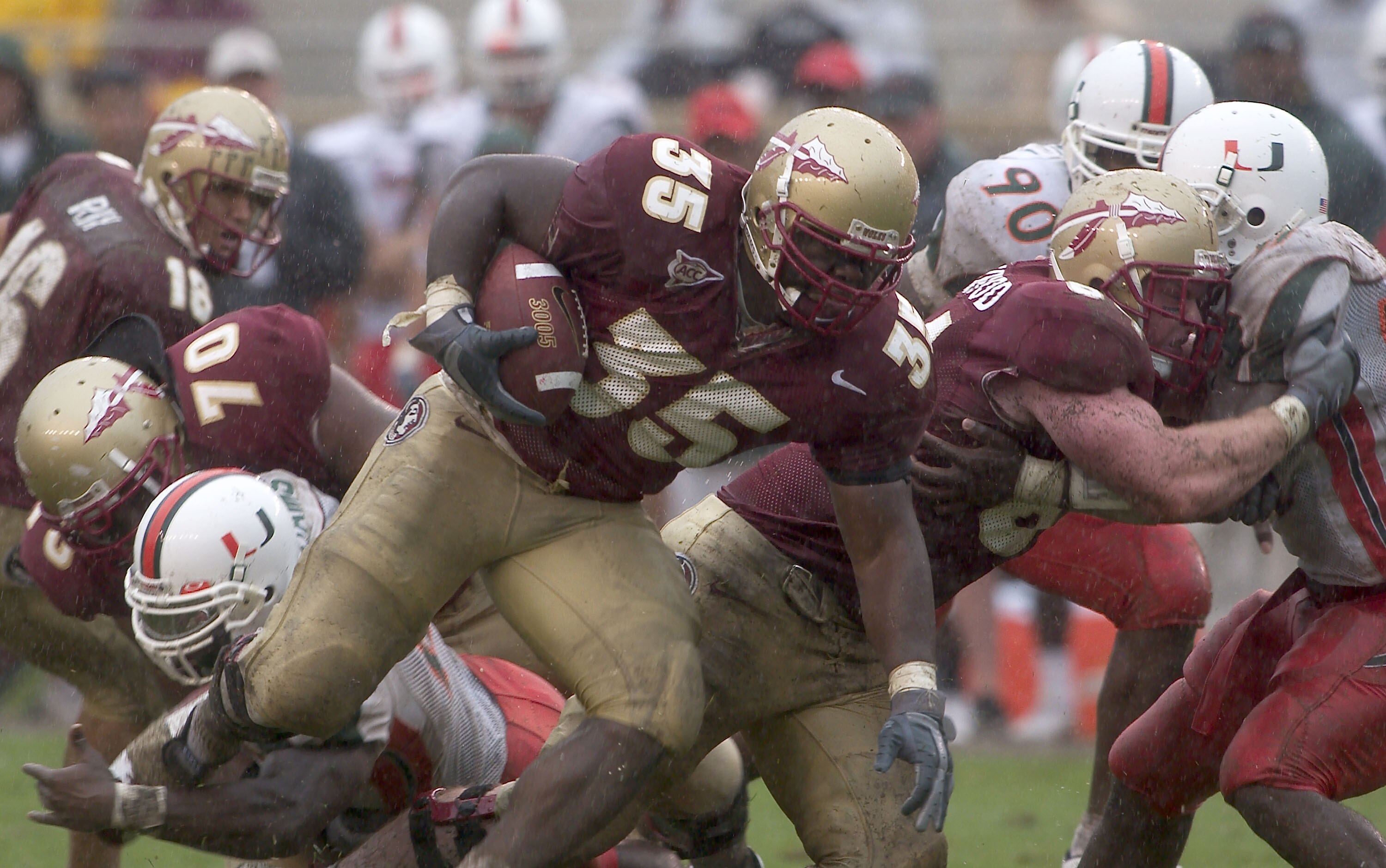 TALLAHASSEE, FL - OCTOBER 11:  BJ Dean #36 of the Florida State Seminoles runs for a first down in the fourth quarter against the Miami Hurricanes at Doak Campbell Stadium on October 11, 2003 in Tallahassee, Florida.  (Photo by Matt Stroshane/Getty Images
