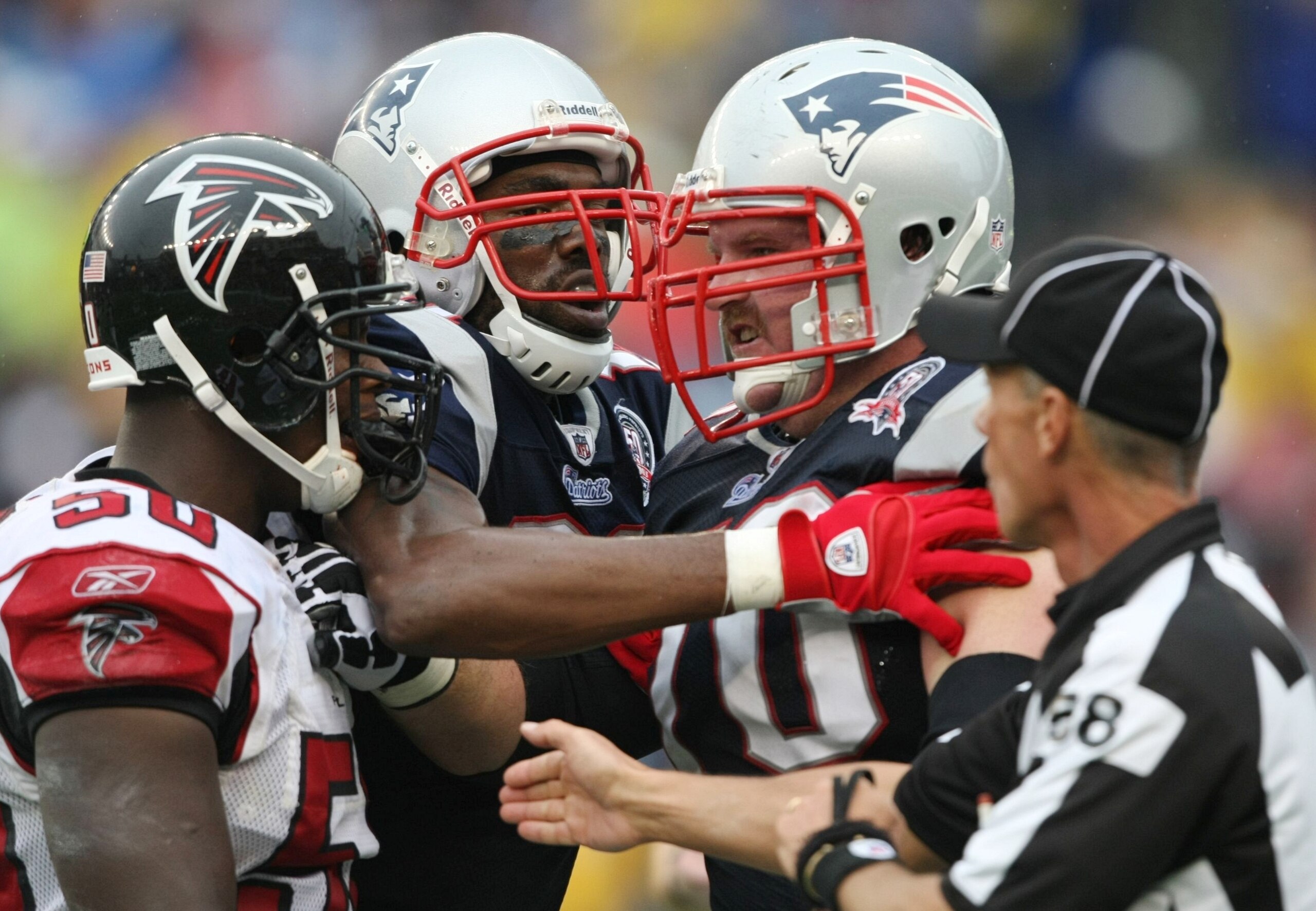 FOXBORO, MA - SEPTEMBER 27: Randy Moss #81 of the New England Patriots breaks up a skirmish between teammate Logan Mankins #70 and Curtis Lofton #50 of the Atlanta Falcons in the third quarter of the game at Gillette Stadium on September 27, 2009 in Foxb FOXBORO, MA - SEPTEMBER 27: Randy Moss #81 of the New England Patriots breaks up a skirmish between teammate Logan Mankins #70 and Curtis Lofton #50 of the Atlanta Falcons in the third quarter of the game at Gillette Stadium on September 27, 2009 in Foxb