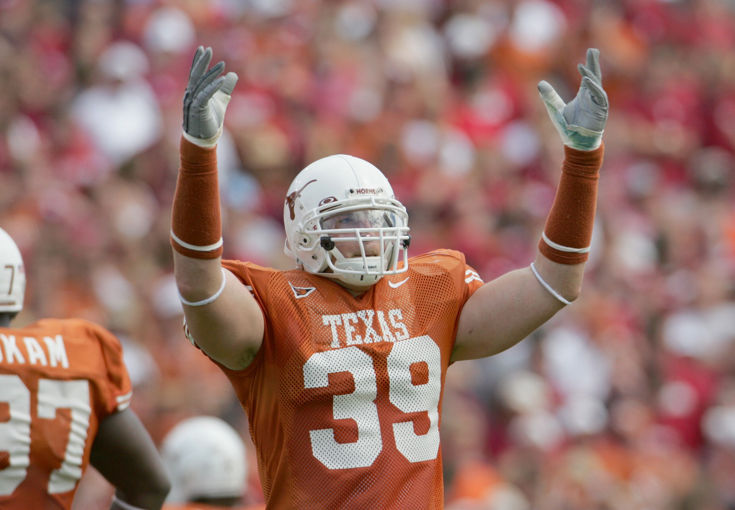 DALLAS - OCTOBER 8: Defensive end Brian Robison #39 of the Texas Longhorns celebrates against the Oklahoma Sooners on October 8, 2005 at the Cotton Bowl in Dallas, Texas. The Longhorns defeated the Sooners 45-12. (Photo by Ronald Martinez/Getty Images) DALLAS - OCTOBER 8: Defensive end Brian Robison #39 of the Texas Longhorns celebrates against the Oklahoma Sooners on October 8, 2005 at the Cotton Bowl in Dallas, Texas. The Longhorns defeated the Sooners 45-12. (Photo by Ronald Martinez/Getty Images)