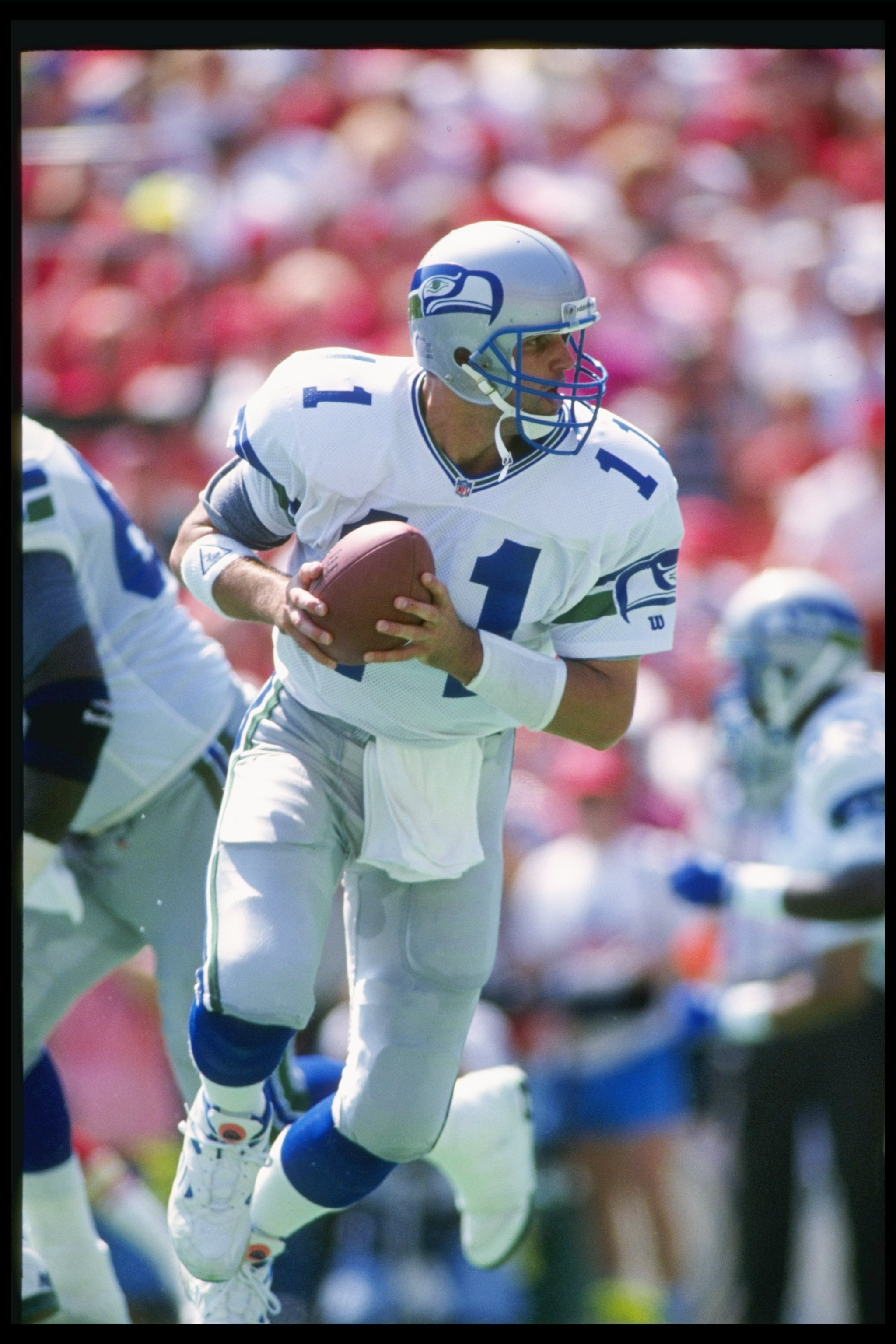 Seattle Seahawks - Seahawks quarterback Rick Mirer attempts to elude  Derrick Thomas during an NFL Football game against the Kansas City Chiefs  on January 2, 1994 in Kansas City, Missouri.