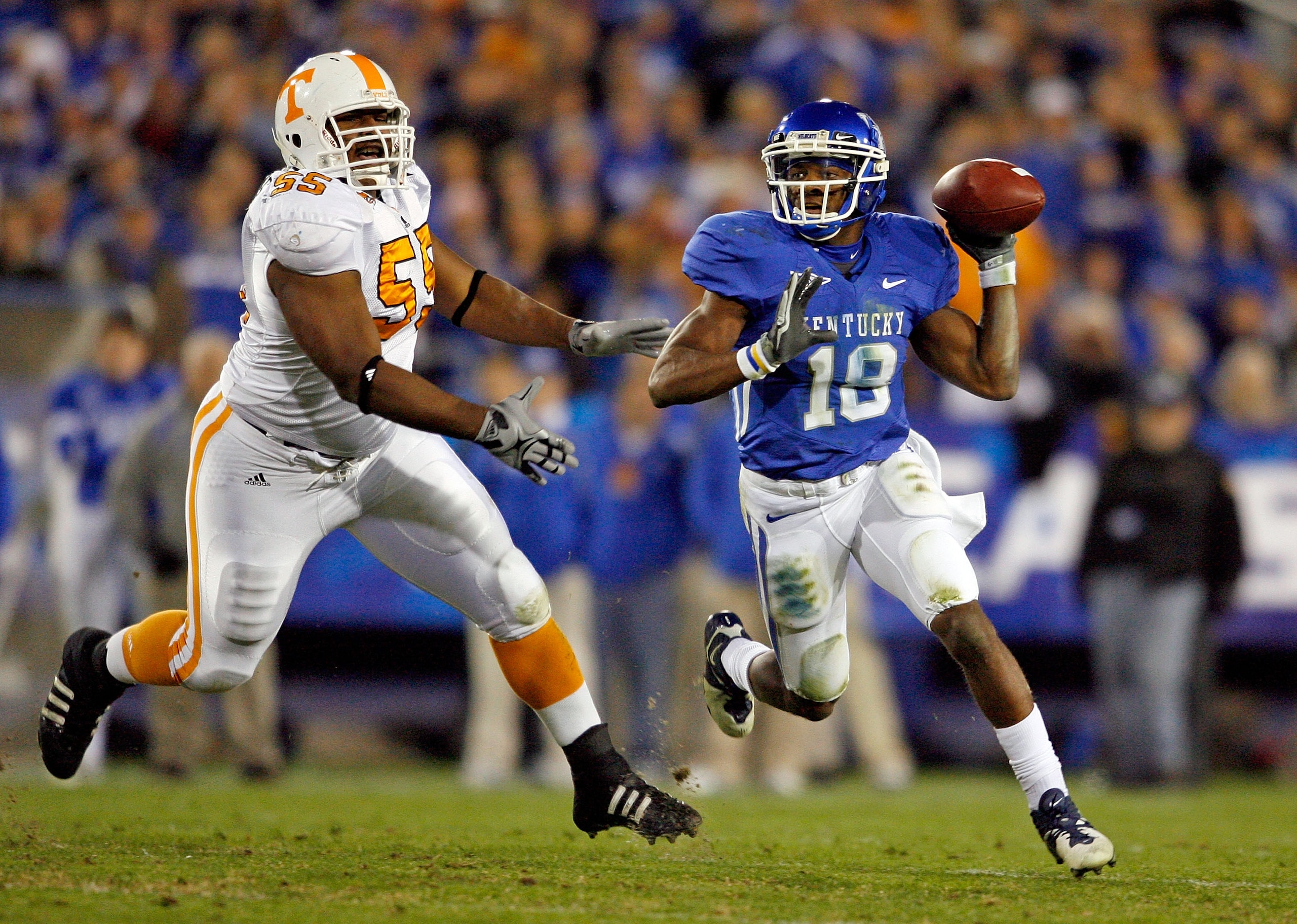 LEXINGTON, KY - NOVEMBER 28: Randall Cobb #18 of the Kentucky Wildcats looks to pass the ball while defended by Dan Williams #55 of the Tennessee Volunteers during the SEC game at Commonwealth Stadium on November 28, 2009 in Lexington, Kentucky. (Photo LEXINGTON, KY - NOVEMBER 28: Randall Cobb #18 of the Kentucky Wildcats looks to pass the ball while defended by Dan Williams #55 of the Tennessee Volunteers during the SEC game at Commonwealth Stadium on November 28, 2009 in Lexington, Kentucky. (Photo