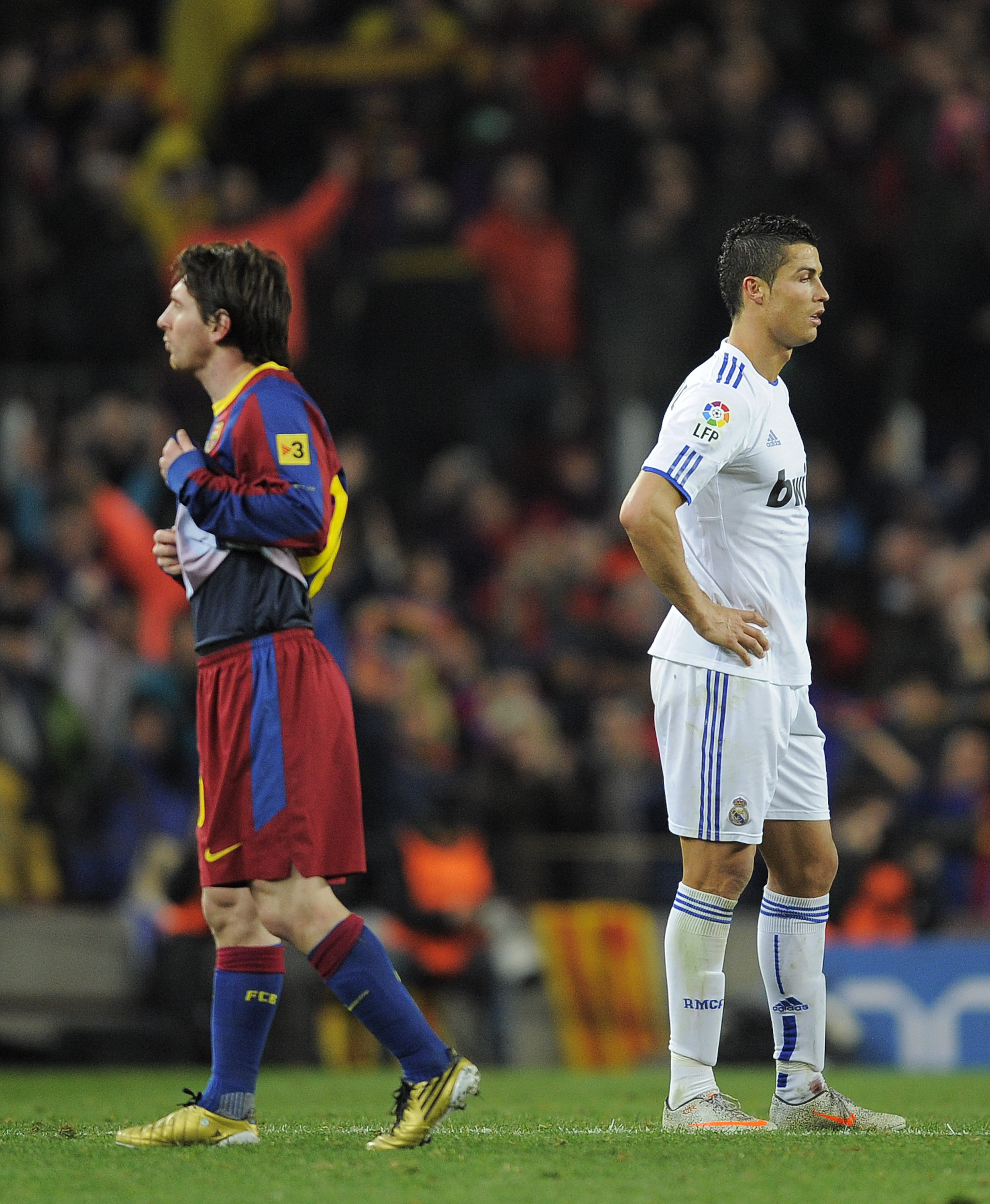 BARCELONA, SPAIN - NOVEMBER 29:  Cristiano Ronaldo of Real Madrid (R) and Lionel Messi of FC Barcelona look on during the La Liga match between Barcelona and Real Madrid at the Camp Nou Stadium on November 29, 2010 in Barcelona, Spain.  Barcelona won the