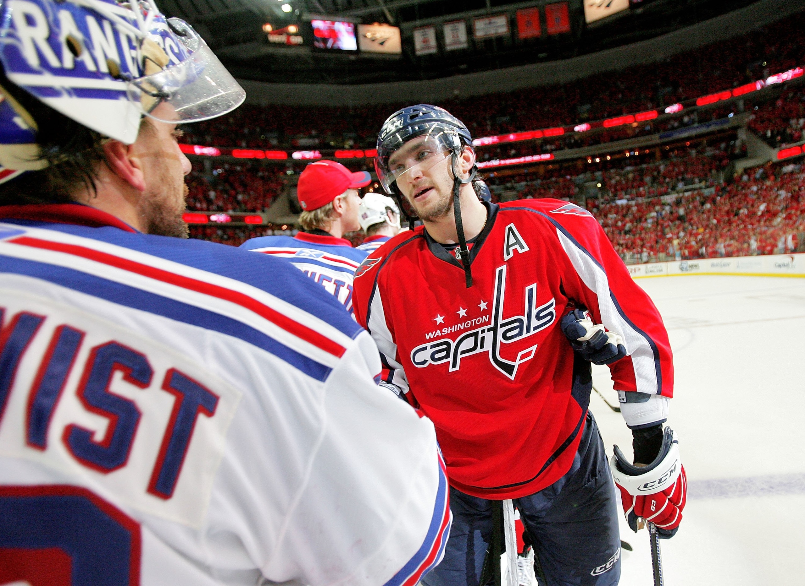WASHINGTON - APRIL 28:  Alex Ovechkin #8 of the Washington Capitals shakes the hand of Henrik Lundqvist #30 of the New York Rangers after defeating him during Game Seven of the Eastern Conference Quarterfinal Round of the 2009 Stanley Cup Playoffs on Apri