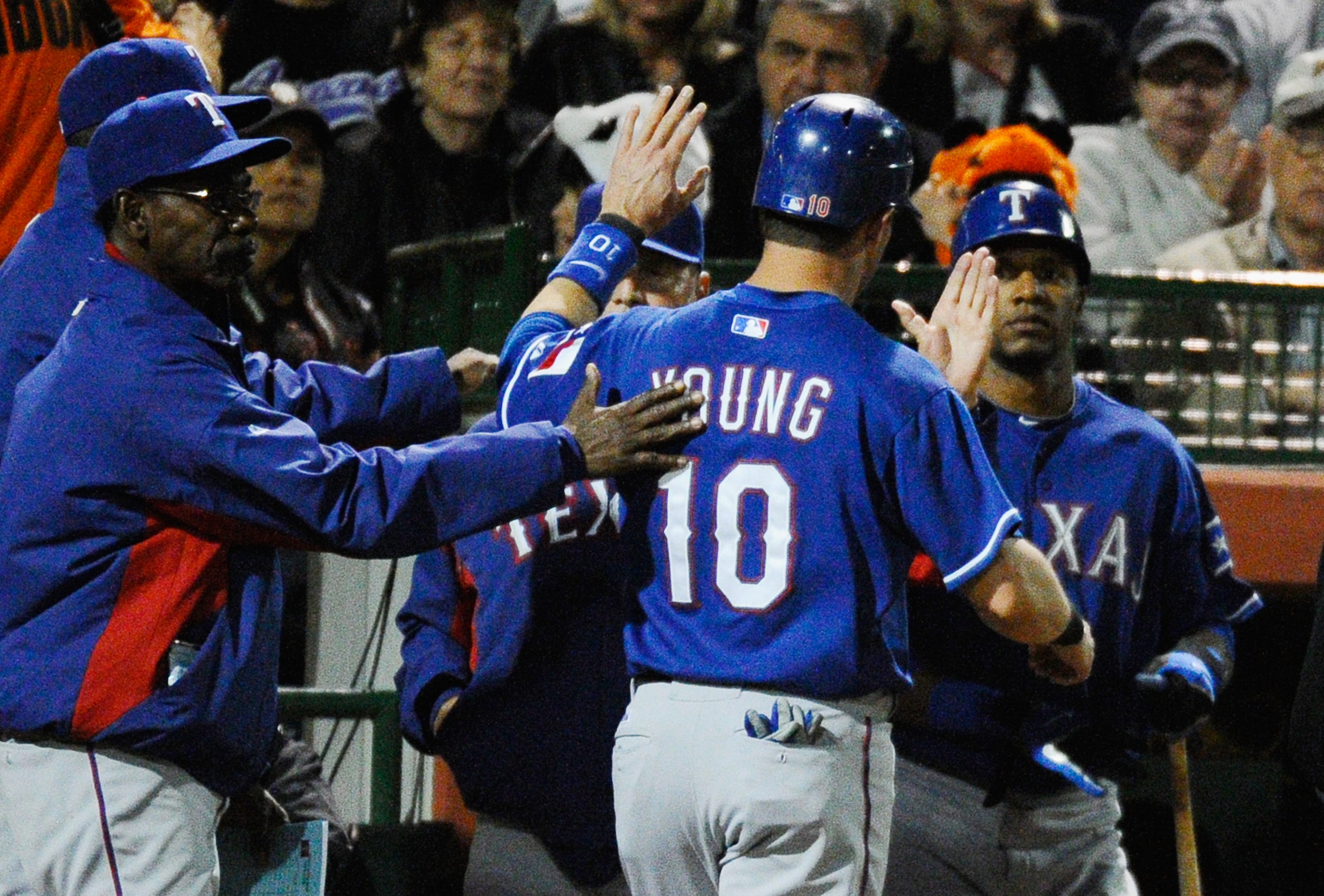 SCOTTSDALE, AZ - MARCH 07: Michael Young #10 of the Texas Rangers is congratulated by manager Ron Washington (L) after scoring a run on a double by teammate Yorvit Torrealba in the first inning against the San Francisco Giants in the first meeting betwee SCOTTSDALE, AZ - MARCH 07: Michael Young #10 of the Texas Rangers is congratulated by manager Ron Washington (L) after scoring a run on a double by teammate Yorvit Torrealba in the first inning against the San Francisco Giants in the first meeting betwee