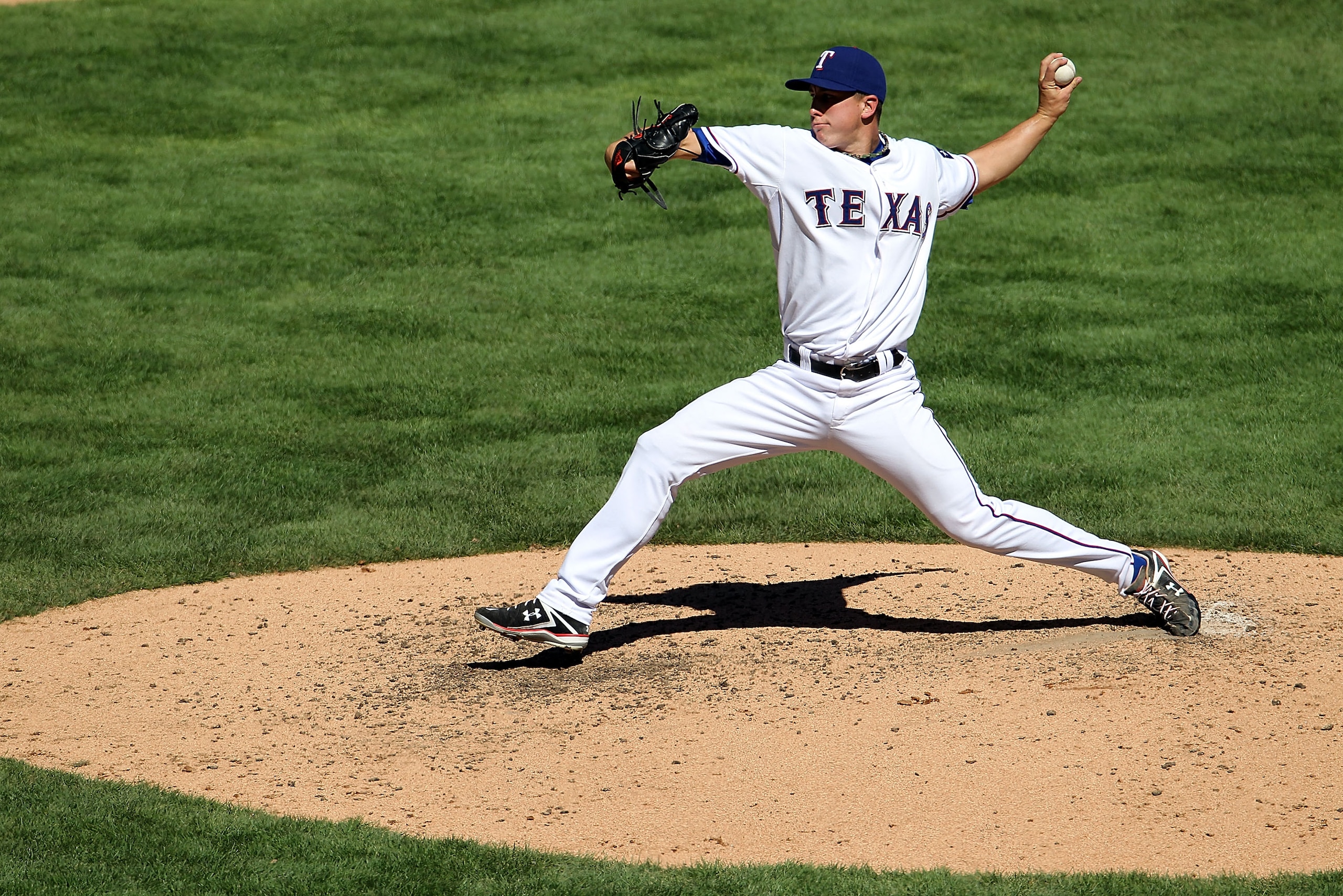 ARLINGTON, TX - SEPTEMBER 29: Pitcher Derek Holland #45 of the Texas Rangers throws against the Seattle Mariners at Rangers Ballpark in Arlington on September 29, 2010 in Arlington, Texas. (Photo by Ronald Martinez/Getty Images) ARLINGTON, TX - SEPTEMBER 29: Pitcher Derek Holland #45 of the Texas Rangers throws against the Seattle Mariners at Rangers Ballpark in Arlington on September 29, 2010 in Arlington, Texas. (Photo by Ronald Martinez/Getty Images)