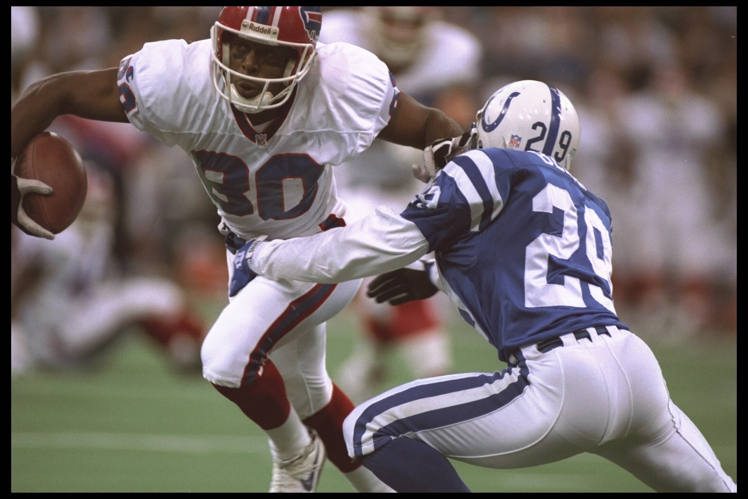 5 Nov 1995:  Wide receiver Bill Brooks #80 of the Buffalo Bills tries to escape the clutches of centerback Jason Belser #29 of the Indianapolis Colts at the RCA Dome in Indianapolis, Indiana.  The Bills defeated the Colts 16-10.  Mandatory Credit:  Andy L