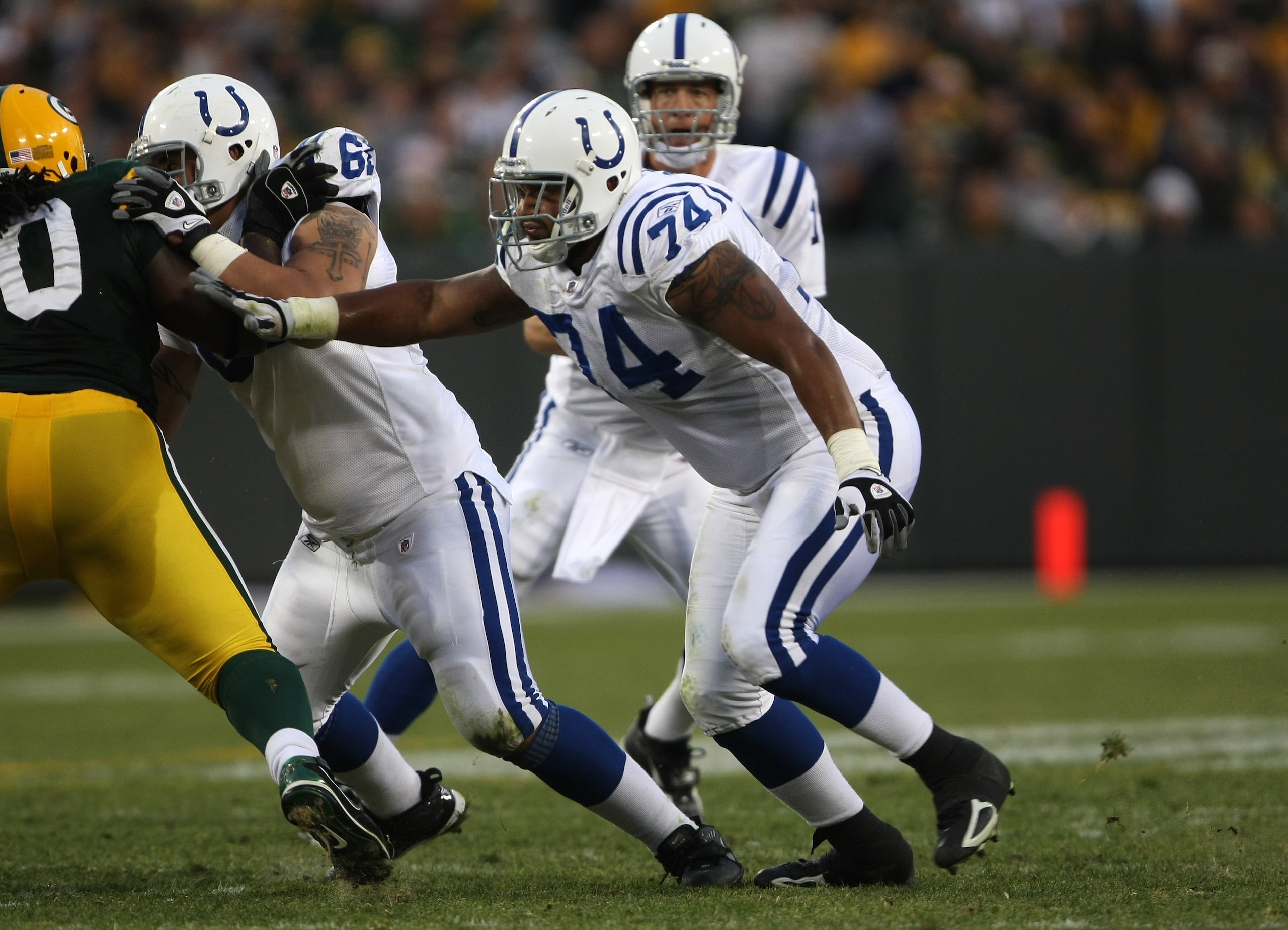 GREEN BAY, WI - OCTOBER 19: Tackle Charlie Johnson #74 of the Indianapolis Colts blocks against the Green Bay Packers on October 19, 2008 at Lambeau Field in Green Bay Wisconsin. The Packers won 34-14.   (Photo by Stephen Dunn/Getty Images)