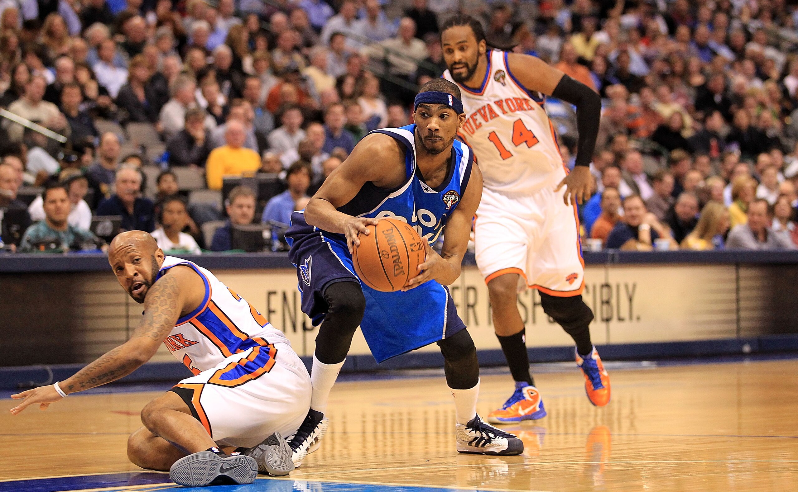 DALLAS, TX - MARCH 10:  Forward Corey Brewer #13 of the Dallas Mavericks steals the ball from Anthony Carter #25 of the New York Knicks at American Airlines Center on March 10, 2011 in Dallas, Texas.  NOTE TO USER: User expressly acknowledges and agrees t