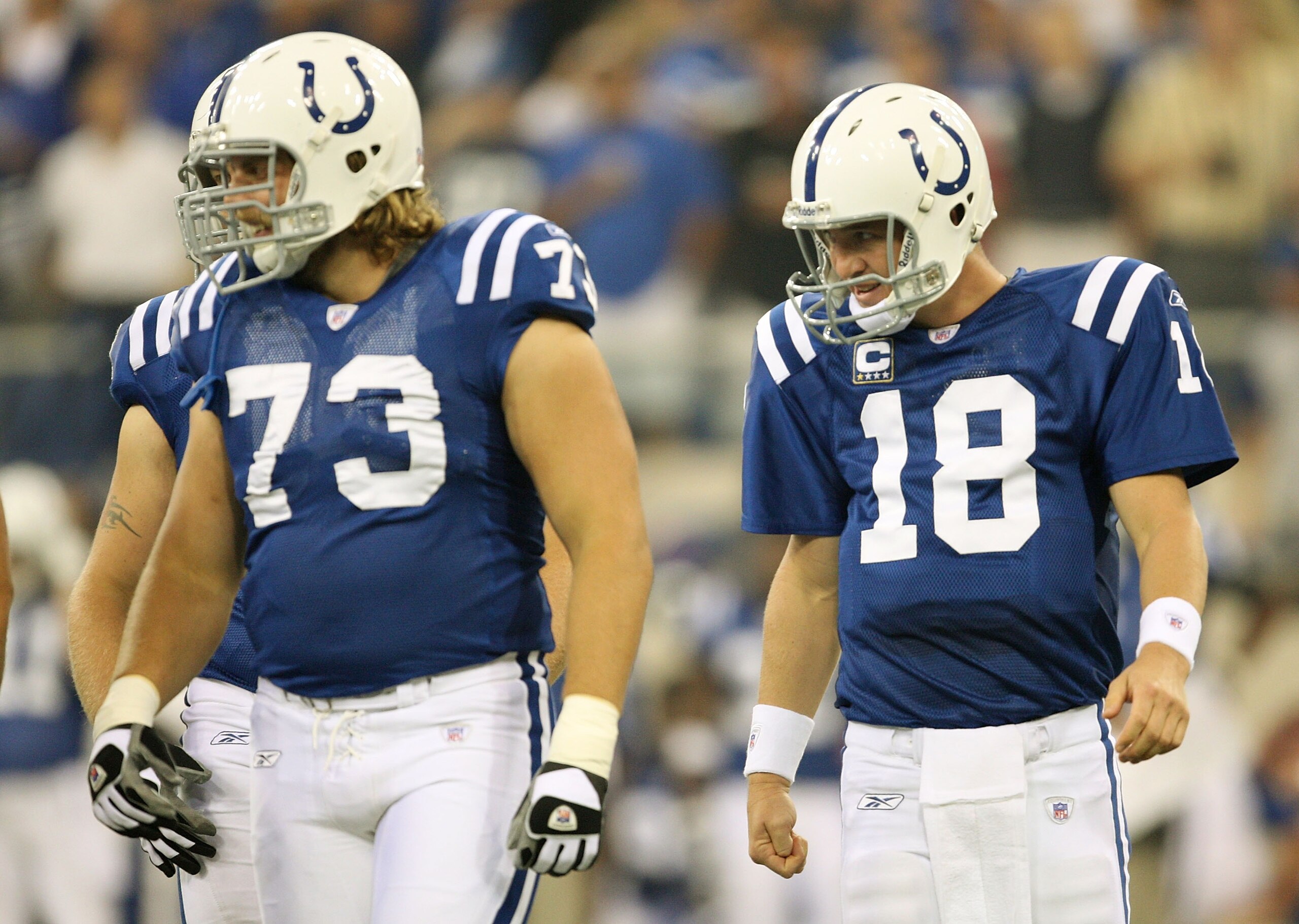 INDIANAPOLIS - SEPTEMBER 06:  Quarterback Peyton Manning #18 of the Indianapolis Colts walks to the line of scrimmage behind Jake Scott #73 during their game against the New Orleans Saints in the first NFL game of the season at the RCA Dome on September 6