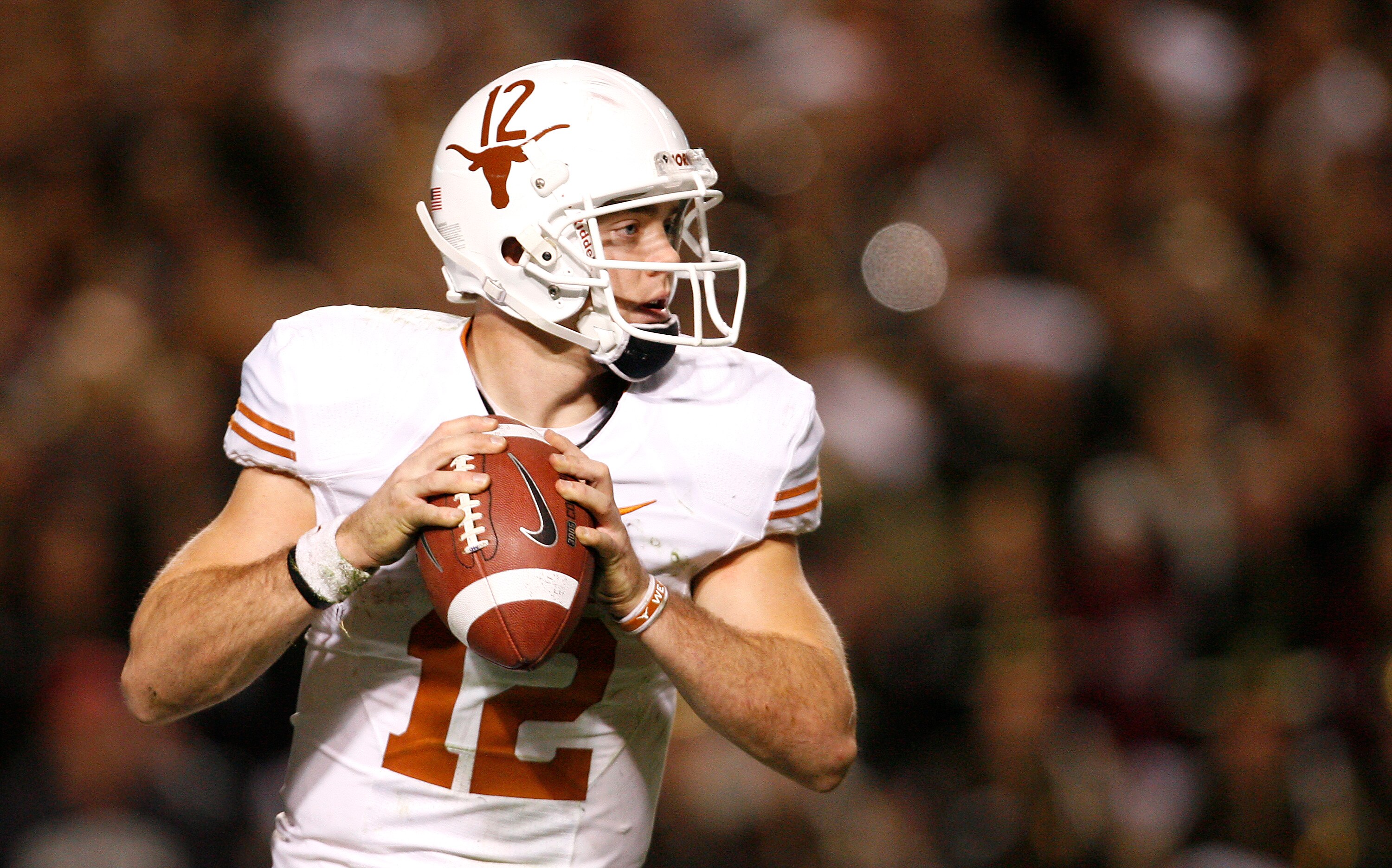 COLLEGE STATION, TX - NOVEMBER 26: Quarterback Colt McCoy #12 of the Texas Longhorns looks to pass the ball downfield against the Texas A&M Aggies in the second half at Kyle Field on November 26, 2009 in College Station, Texas. The Longhorns defeated the