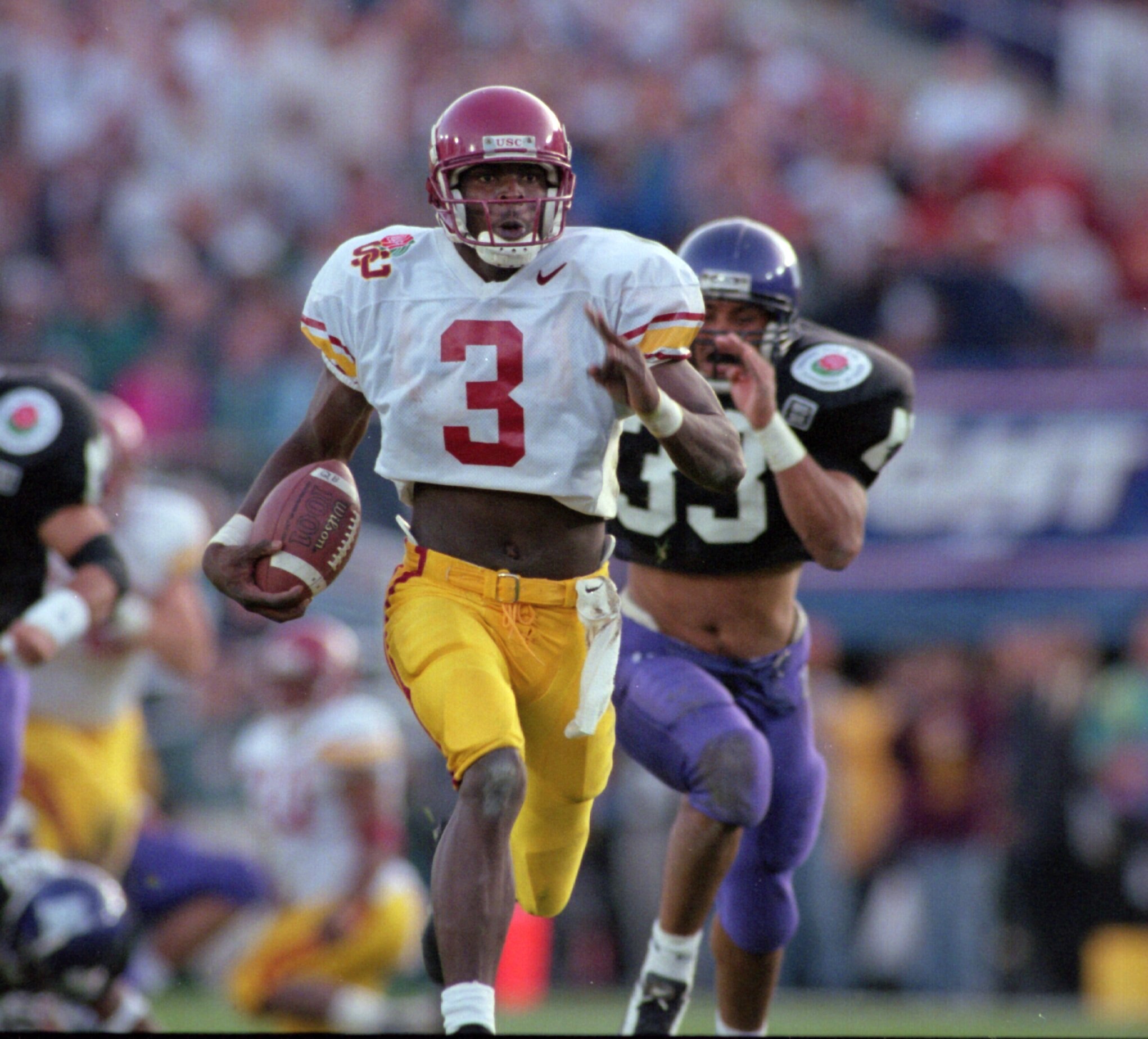 1 Jan 1996:  Wide receiver Keyshawn Johnson #3 of the USC Trojans runs downfield while bing pursued by strong safety Eric Collier #33 of the Northwestern Wildcats during the fourth quarter of the Trojans 42-32 victory over the Wildcats in the 1996 Rose Bo