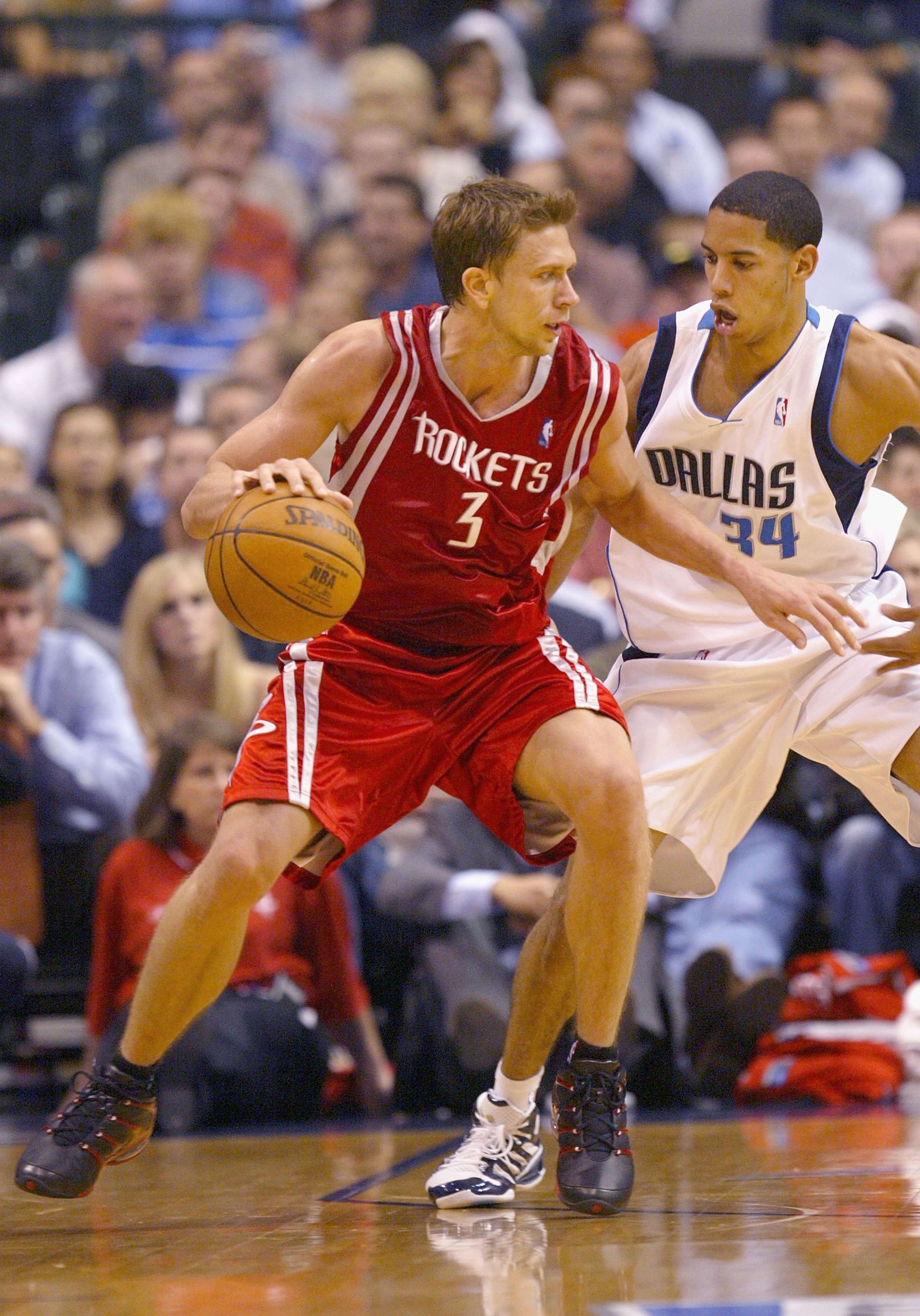 DALLAS - APRIL 25:  Bob Sura #3 of the Houston Rockets handles the ball under pressure from Devin Harris #34 of the Dallas Mavericks in Game two of the Western Conference Quarterfinals during the 2005 NBA Playoffs at the American Airlines Center on April