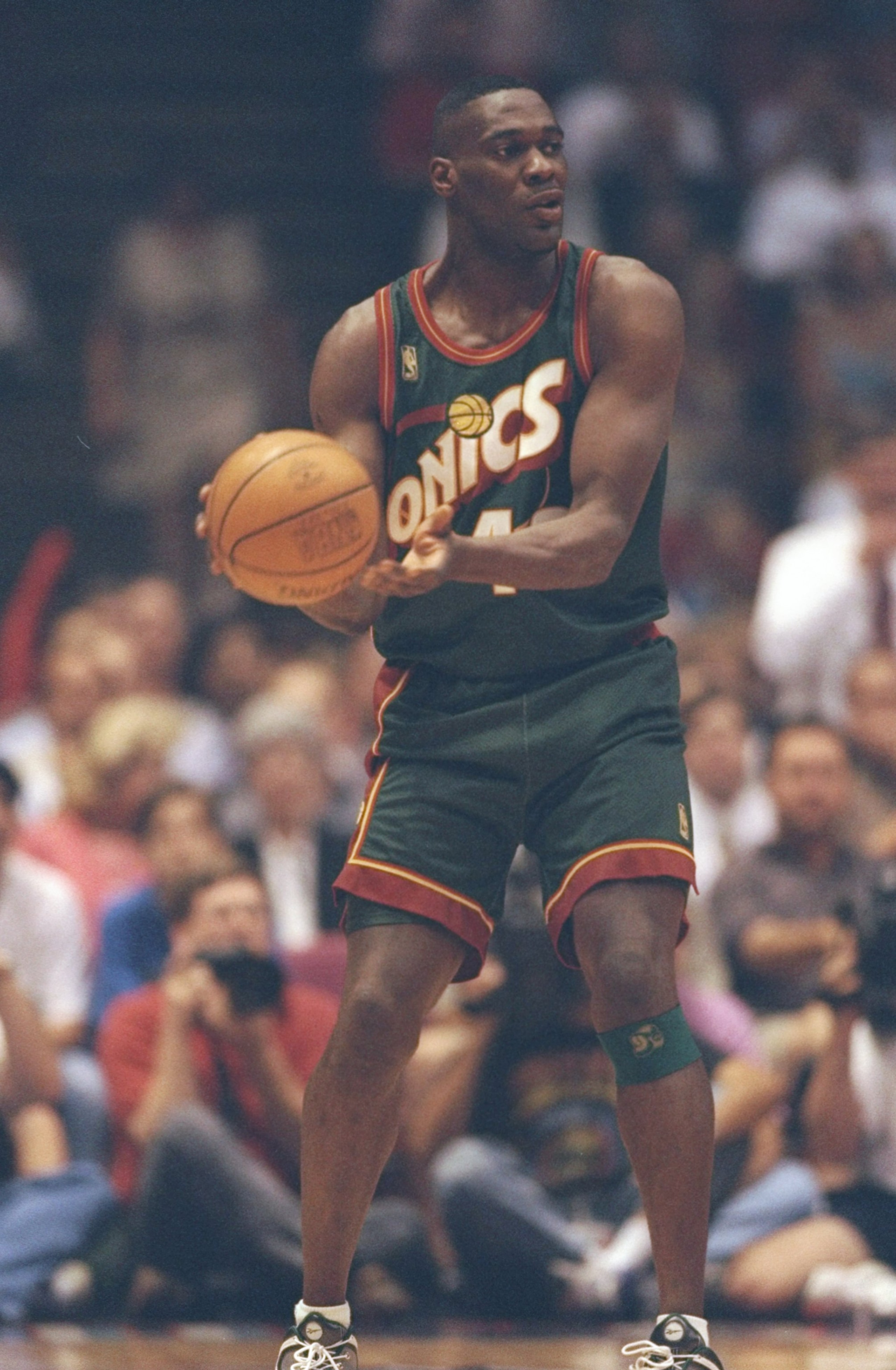 13 May 1997:  Forward Shawn Kemp of the Seattle Supersonics looks to pass the ball during a game against the Houston Rockets at the Summit in Houston, Texas.  The Supersonics won the game 100-94. Mandatory Credit: Stephen Dunn  /Allsport