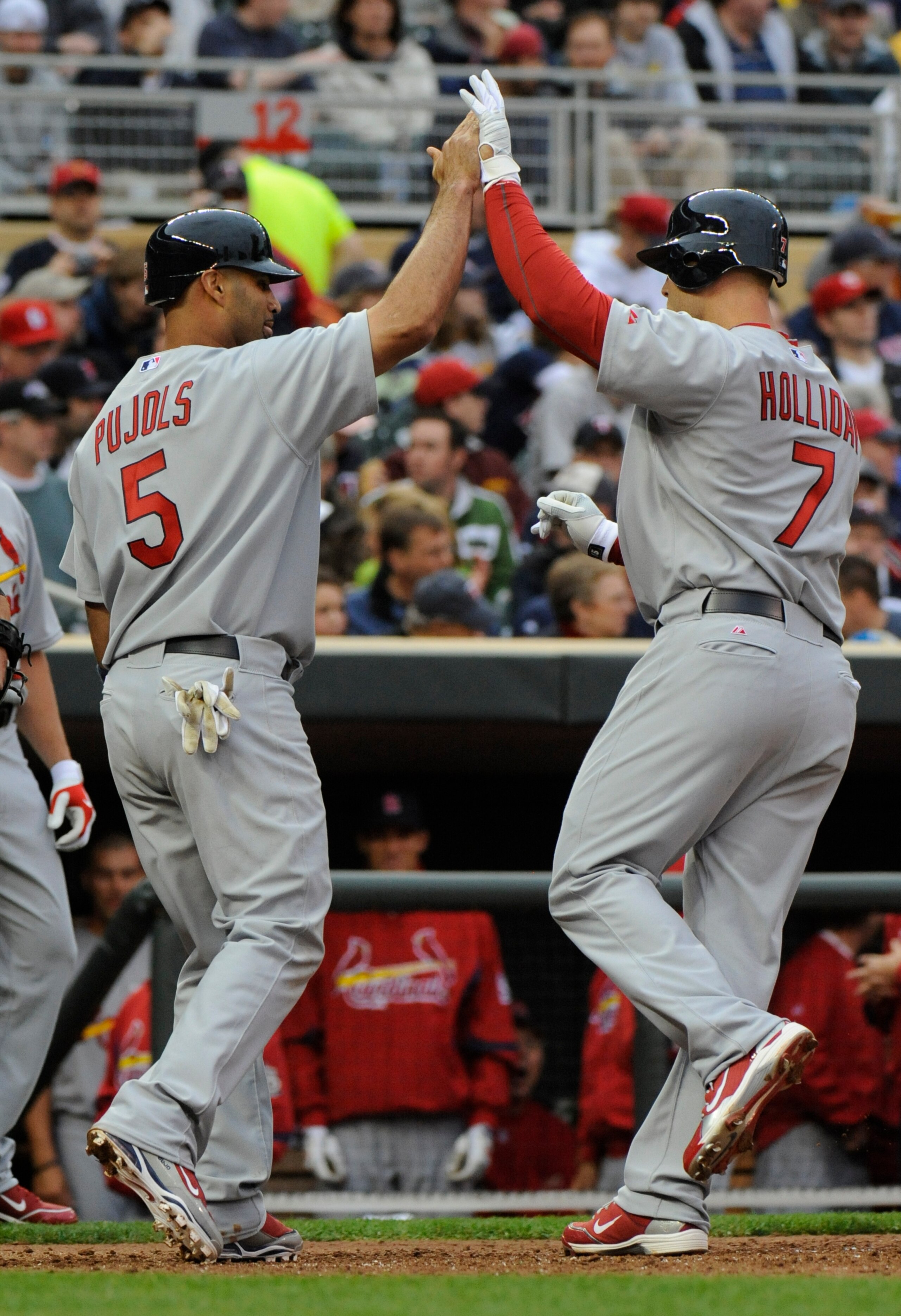 MINNESOTA, MN - APRIL 2: Albert Pujols #5 and Matt Holliday #7 of St. Louis Cardinals celebrate Holliday's fourth inning two-run homerun against the Minnesota Twins during an exhibition game at Target Field on April 2, 2010 in Minneapolis, Minnesota. Card
