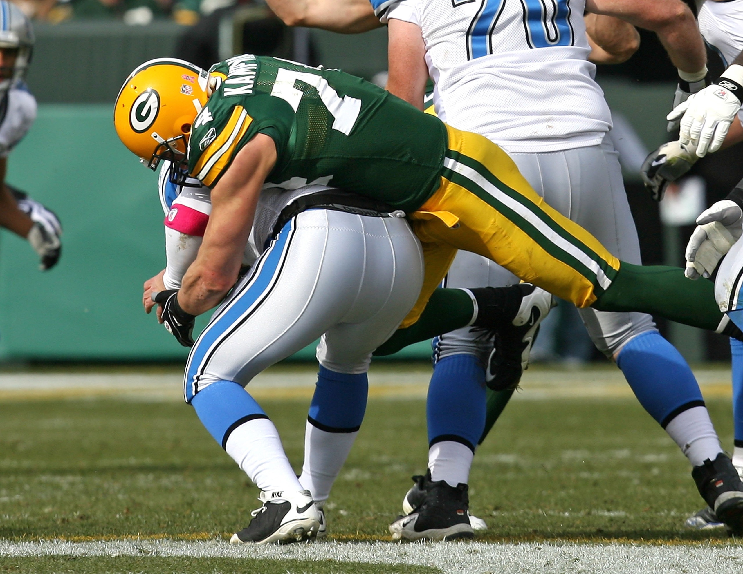 GREEN BAY, WI - OCTOBER 18: Aaron Kampman #74 of the Green Bay Packers sacks Duante Culpepper #11 of the Detroit Lions at Lambeau Field on October 18, 2009 in Green Bay, Wisconsin. The Packers defeated the Lions 26-0. (Photo by Jonathan Daniel/Getty Image