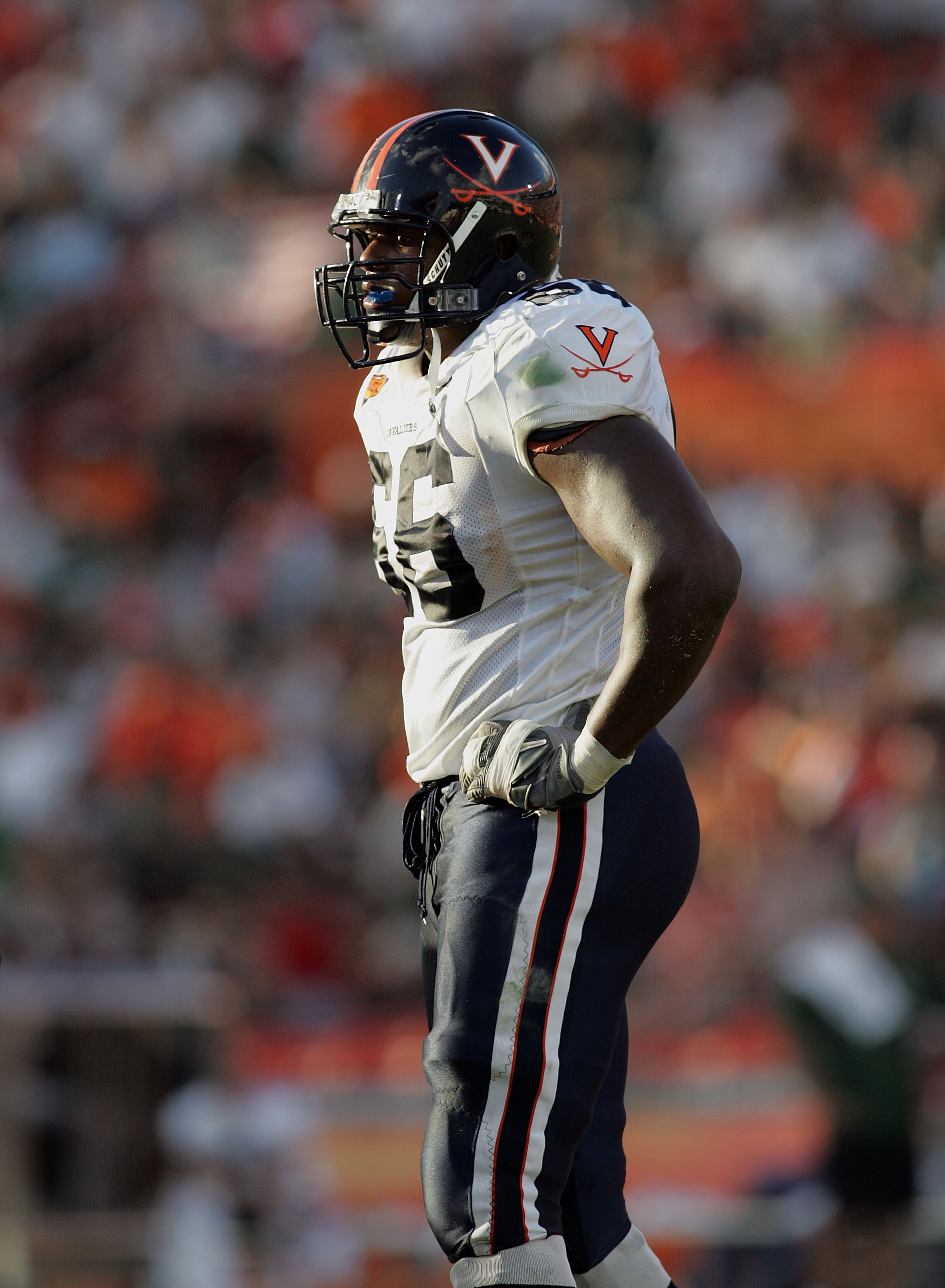 CORAL GABLES, FL - NOVEMBER 26:  Offensive lineman Ferguson D'Brickashaw #66 of the Virginia Cavaliers takes a break in between plays against the Miami Hurricanes at the Orange Bowl on November 26, 2005 in Coral Gables, Florida.  (Photo by Doug Benc/Getty