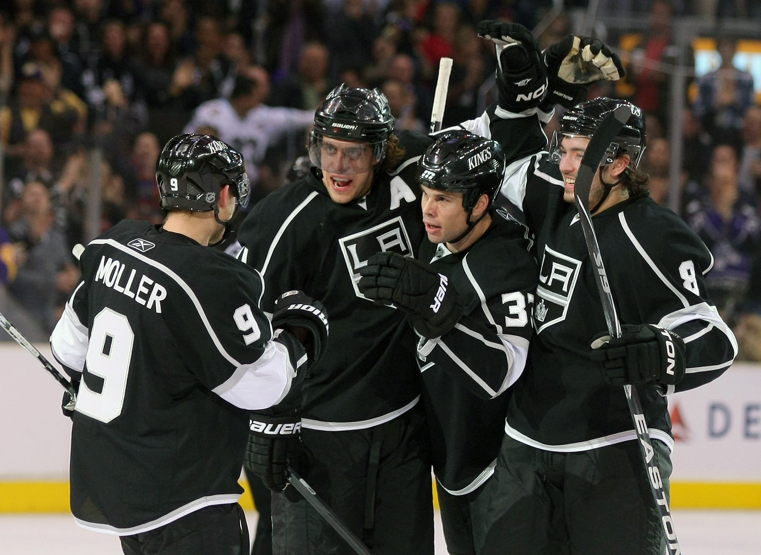 LOS ANGELES, CA - MARCH 24:  Willie Mitchell #33 of the Los Angeles Kings celebrates his goal with teammates Oscar Moller #9, Anze Kopitar #11 and Drew Doughty #8 in the second period during the NHL game against the San Jose Sharks at Staples Center on Ma
