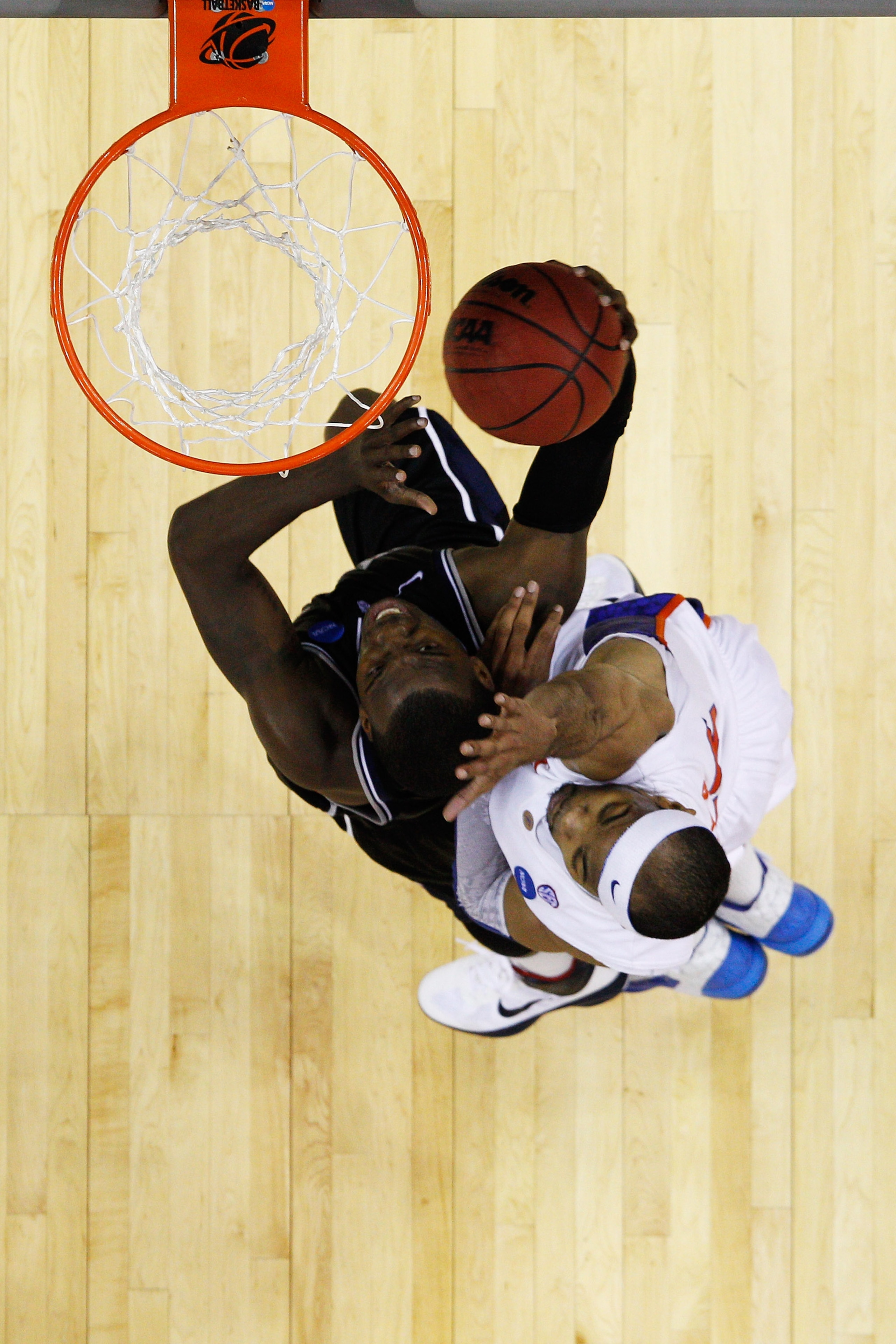 NEW ORLEANS, LA - MARCH 26:  Shelvin Mack #1 of the Butler Bulldogs shoots against Alex Tyus #23 of the Florida Gators during the Southeast regional final of the 2011 NCAA men's basketball tournament at New Orleans Arena on March 26, 2011 in New Orleans,
