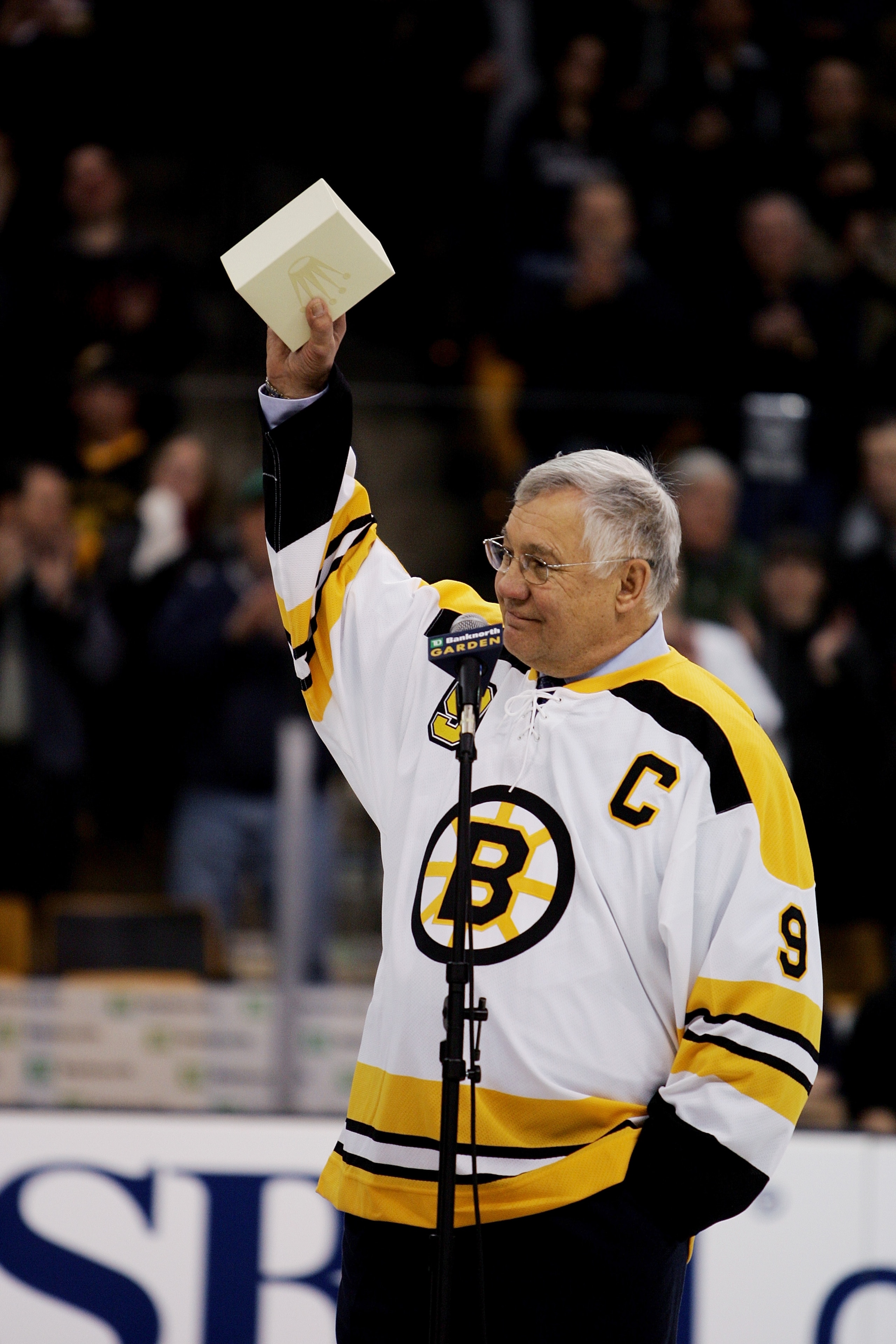 BOSTON - FEBRUARY 13:  Former Boston Bruins player John Bucyk acknowledges the crowd during the ceremony honoring his 50 years with the Bruins organization before the game against the Edmonton Oilers on February 13, 2007 at TD Banknorth Garden in Boston,