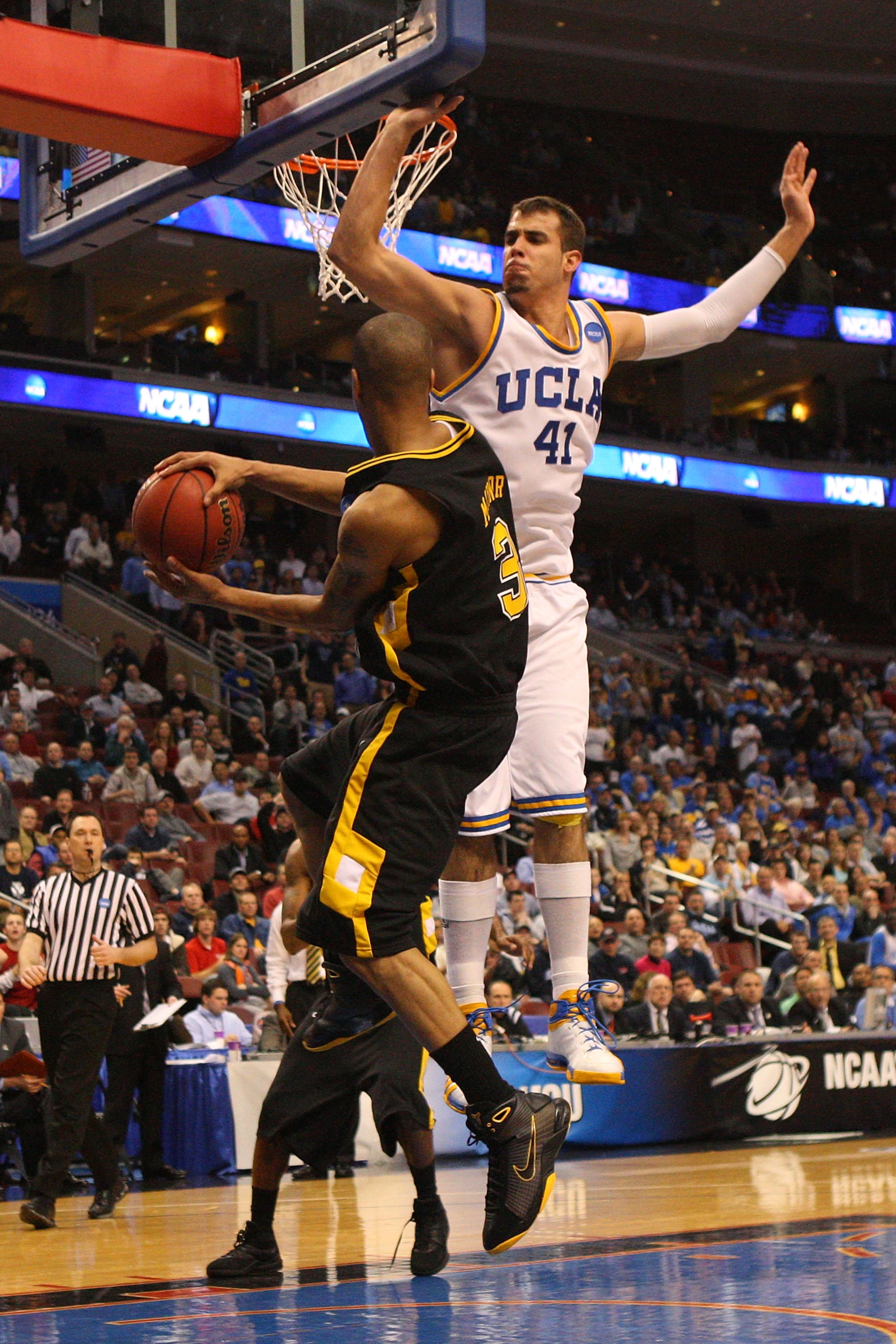 PHILADELPHIA - MARCH 19:  Eric Maynor #3 of the VCU Rams passes against Nikola Dragovic #41 of the UCLA Bruins during the first round of the NCAA Division I Men's Basketball Tournament at the Wachovia Center on March 19, 2009 in Philadelphia, Pennsylvania