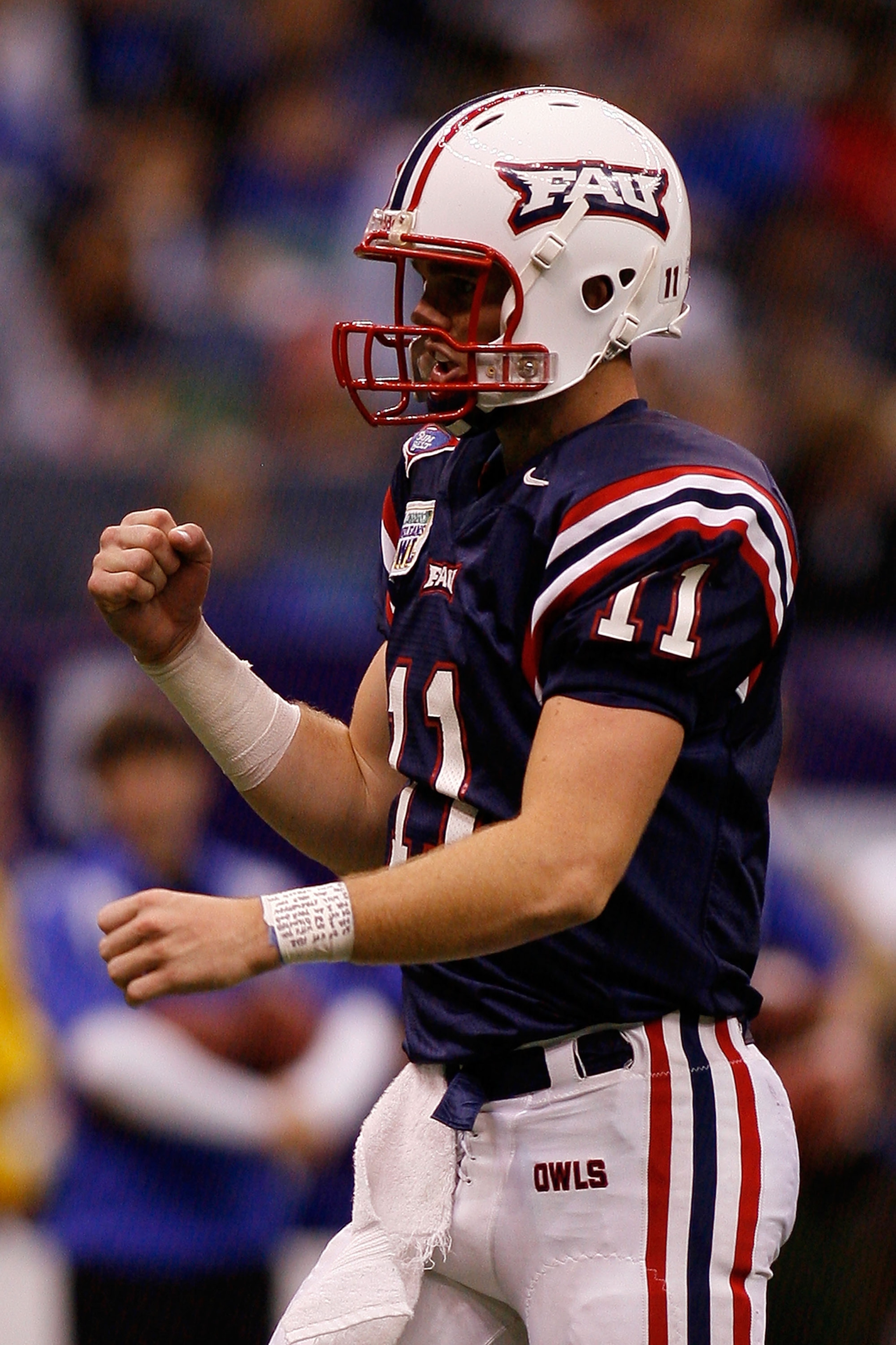 NEW ORLEANS - DECEMBER 21:  MVP and quarterback of the Florida Atlantic University Owls Rusty Smith #11 celebrates after a touchdown against the Memphis University Tigers in the New Orleans Bowl on December 21, 2007 at the Louisiana Superdome in New Orlea