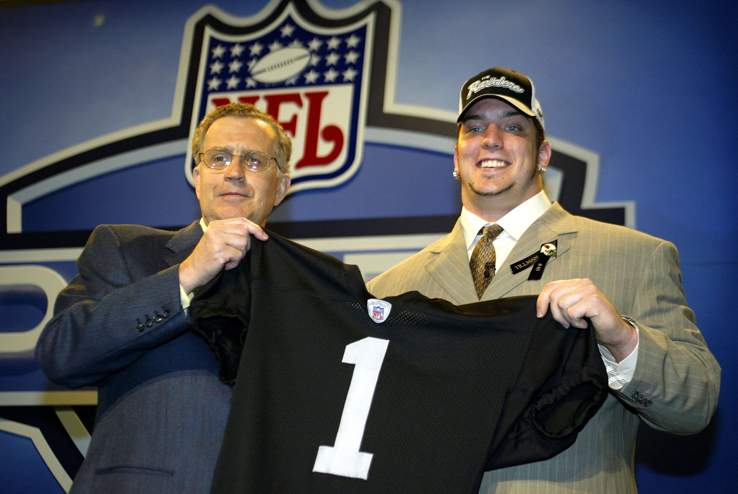 NEW YORK - APRIL 24:  Robert Gallery poses with NFL commissioner Paul Tagliabue during the 2004 NFL Draft on April 24, 2004 at Madison Square Garden in New York City. Gallery was selected the 2nd draft pick overall by the Oakland Raiders.  (Photo by Chris