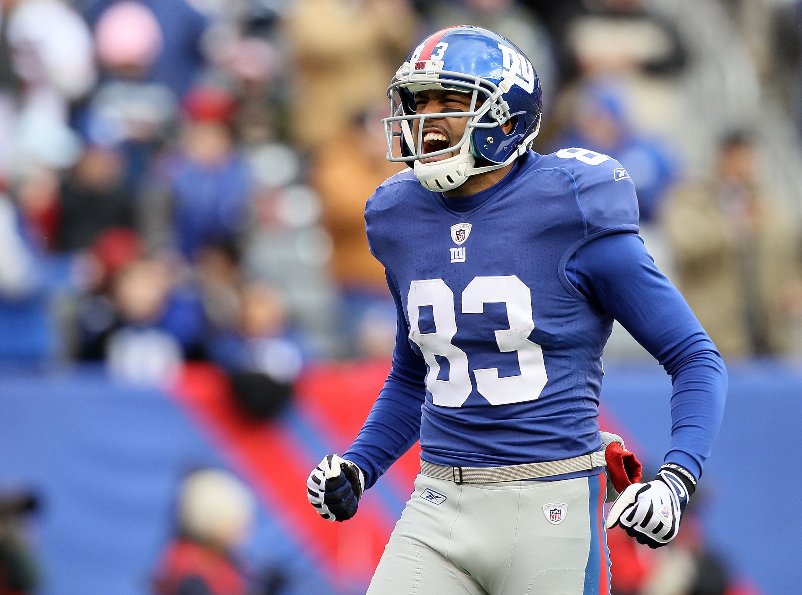 EAST RUTHERFORD, NJ - DECEMBER 05:  Michael Clayton #83 of the New York Giants fires up the crowd prior to the opening kick off against the Washington Redskins on December 5, 2010 at the New Meadowlands Stadium in East Rutherford, New Jersey.  (Photo by J