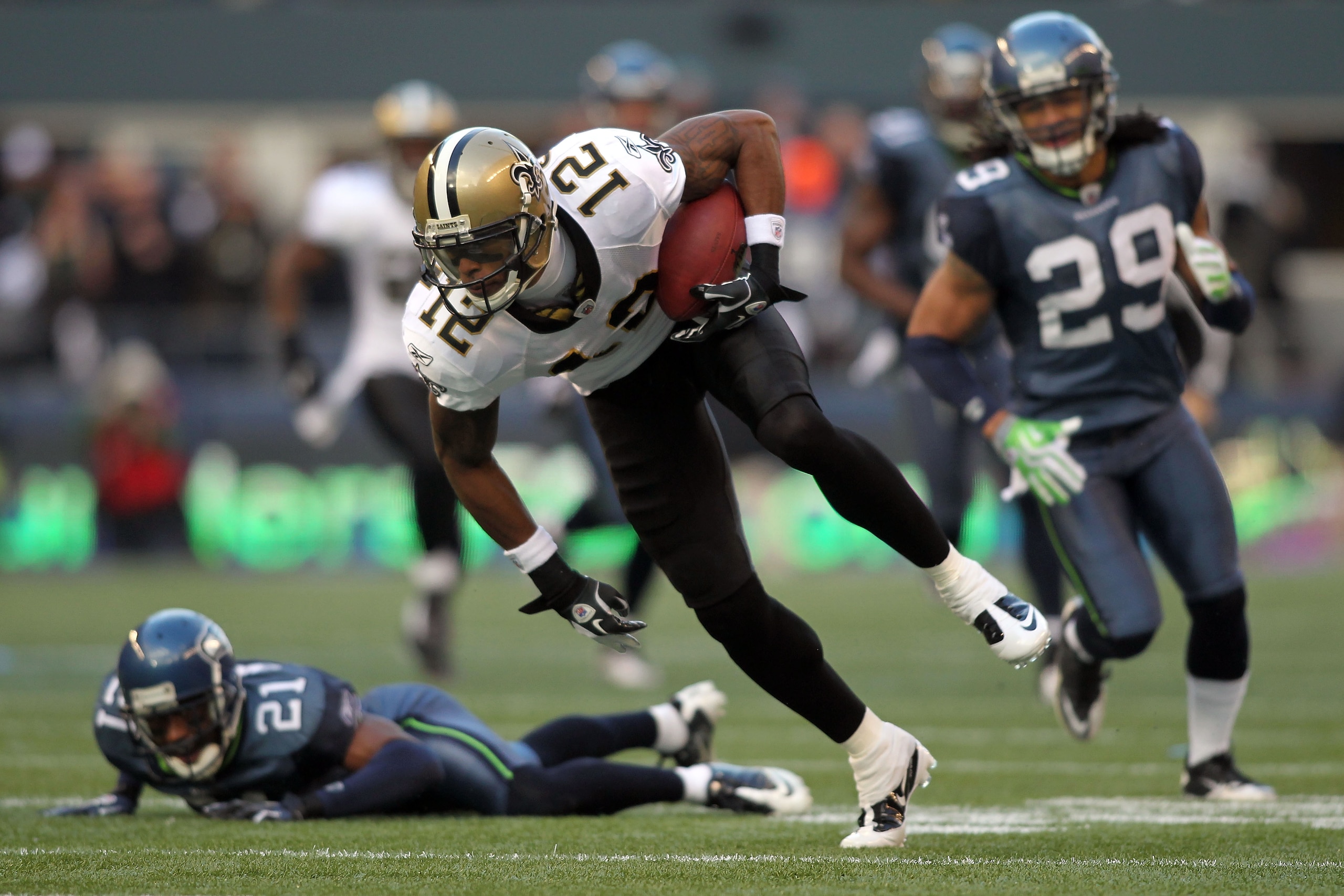 SEATTLE, WA - JANUARY 08:  Marques Colston #12 of the New Orleans Saints runs after a catch for a 30-yard gain against the Seattle Seahawks in the first quarter during the 2011 NFC wild-card playoff game at Qwest Field on January 8, 2011 in Seattle, Washi
