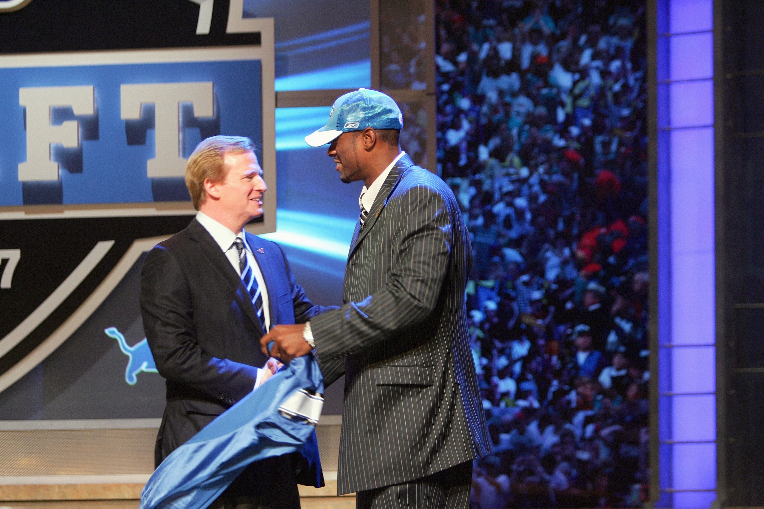 NEW YORK - APRIL 28:  Wide receiver Calvin Johnson of Georgia Tech shakes hands with NFL Commissioner Roger Goodell after being drafted by the Detroit Lions during the 2007 NFL Draft on April 28, 2007 at Radio City Music Hall in New York, New York. (Photo