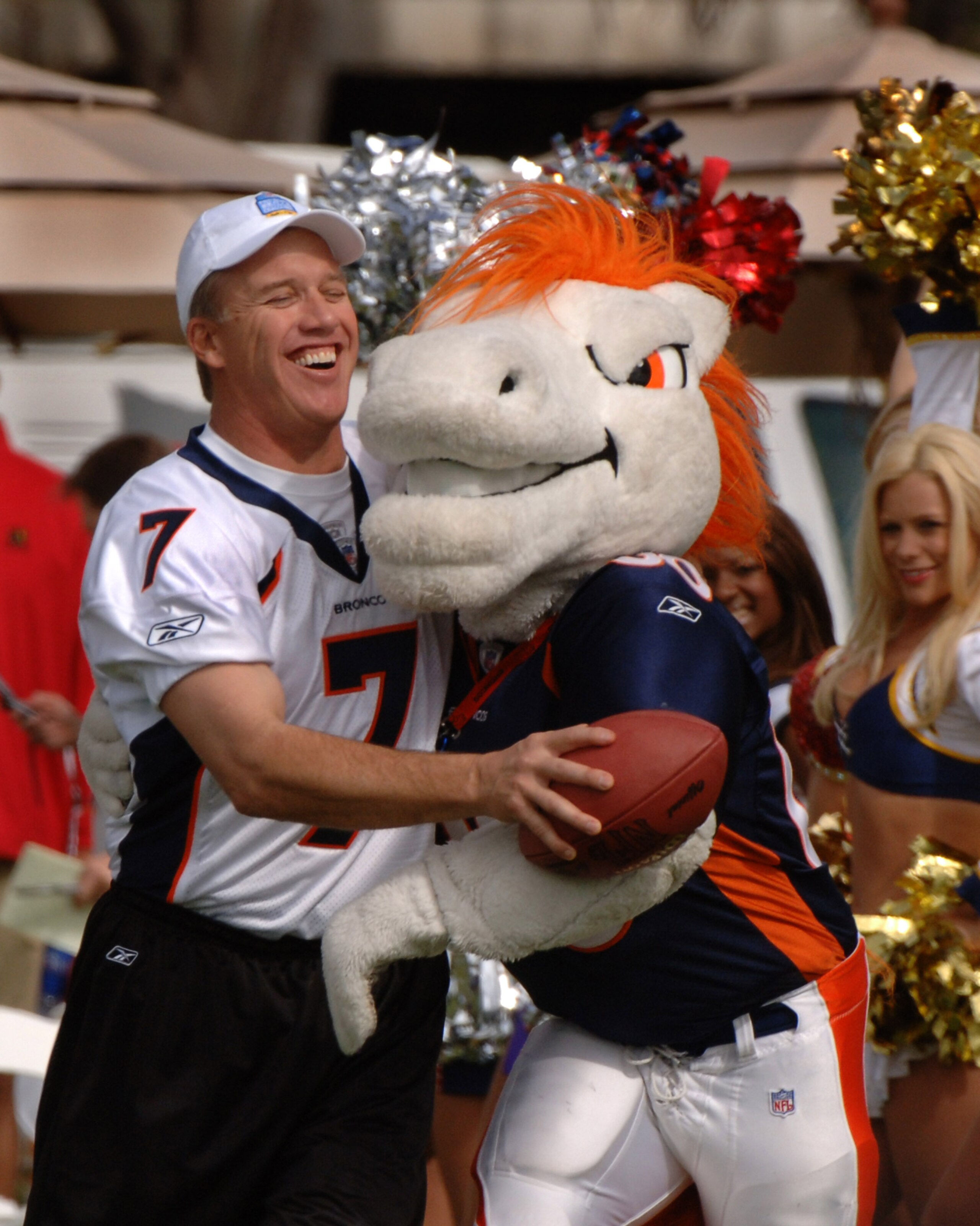 John Elway hugs the Denver Broncos mascot during an alumni air it out flag football game February 10 before the 2006 Pro Bowl in Honolulu. (Photo by Al Messerschmidt/Getty Images) John Elway hugs the Denver Broncos mascot during an alumni air it out flag football game February 10 before the 2006 Pro Bowl in Honolulu. (Photo by Al Messerschmidt/Getty Images)