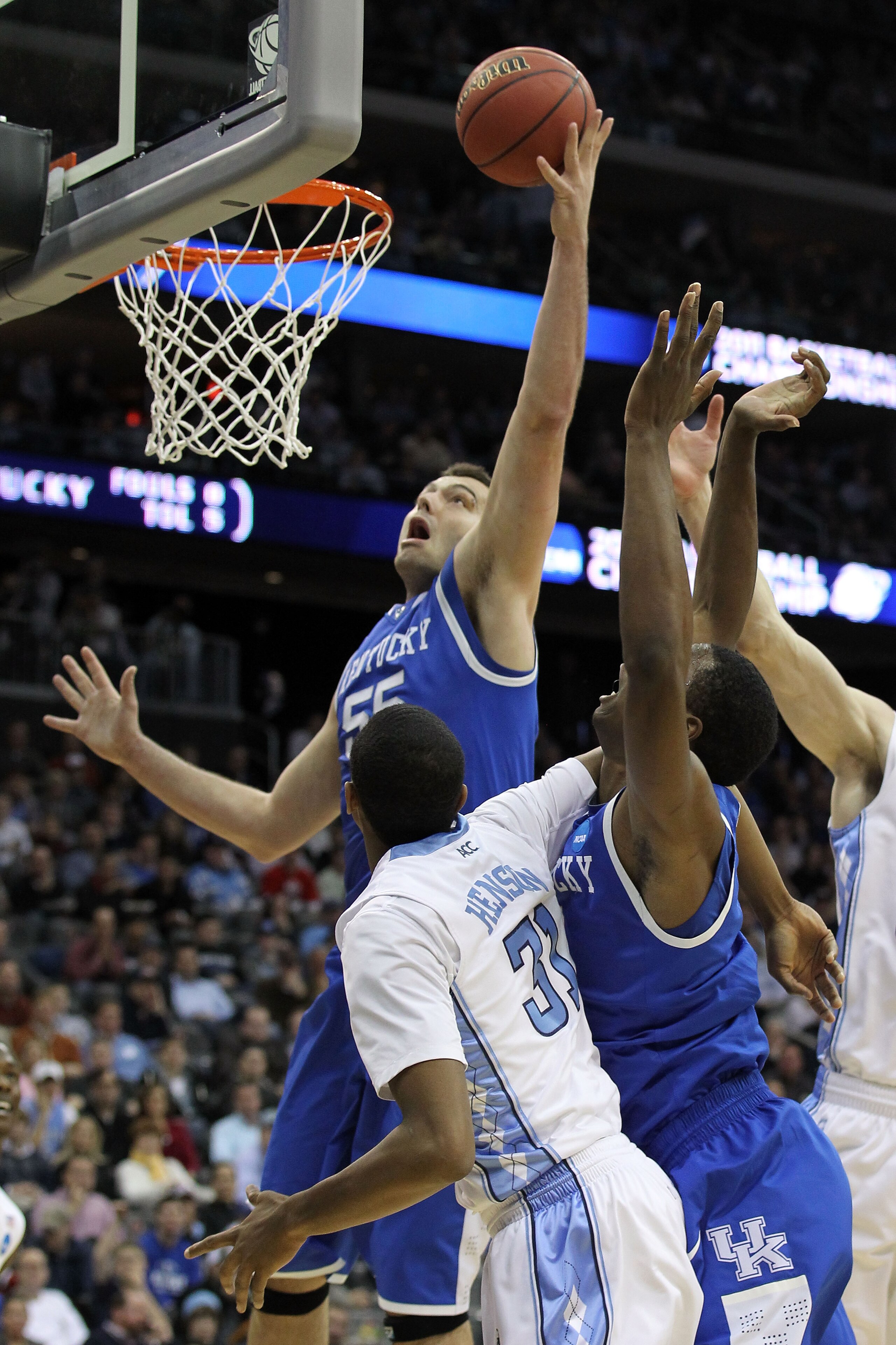 NEWARK, NJ - MARCH 27:  Josh Harrellson #55 of the Kentucky Wildcats in action against the North Carolina Tar Heels during the east regional final of the 2011 NCAA men's basketball tournament at Prudential Center on March 27, 2011 in Newark, New Jersey.