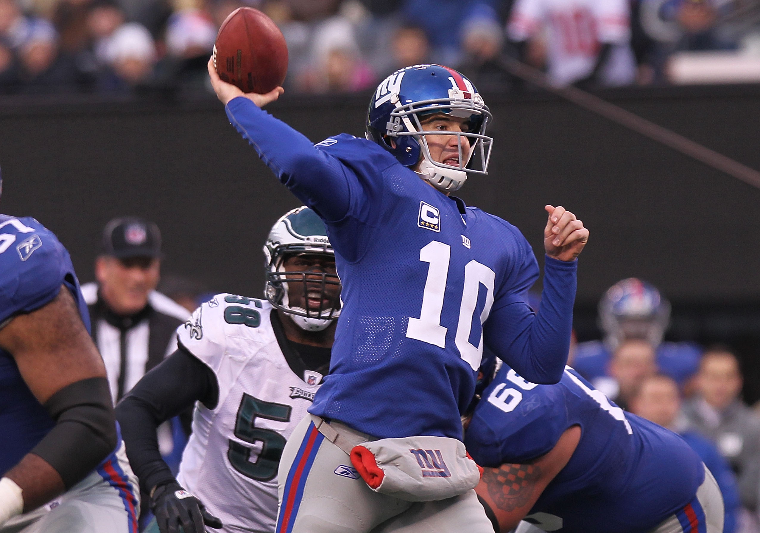 New York Giants Eli Manning celebrates after Plaxico Burress catches a 9  yard touchdown pass in the second quarter against the Philadelphia Eagles  at Giants Stadium in East Rutherford, New Jersey on